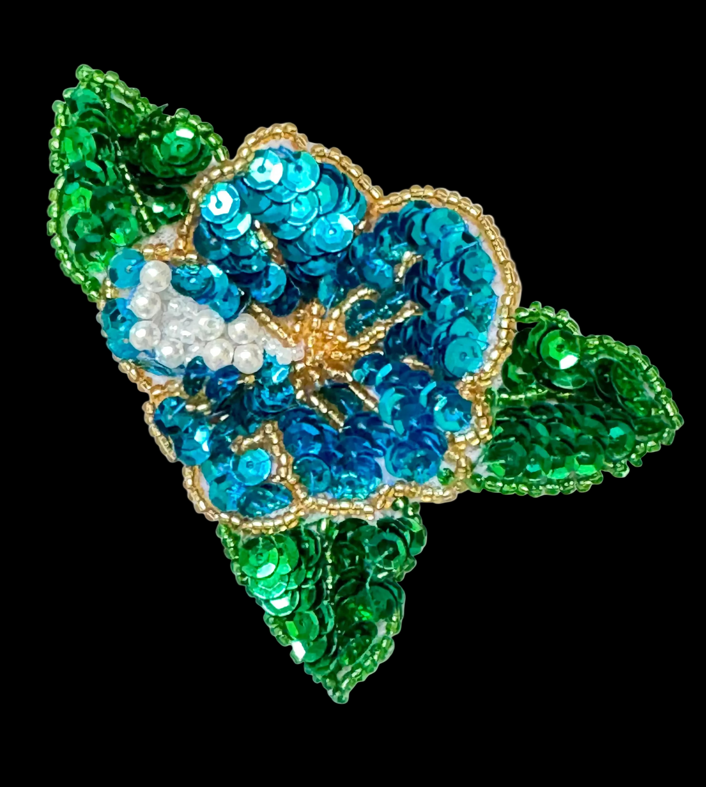 Turquoise and Green sequin patch with gold and green beads on a white background