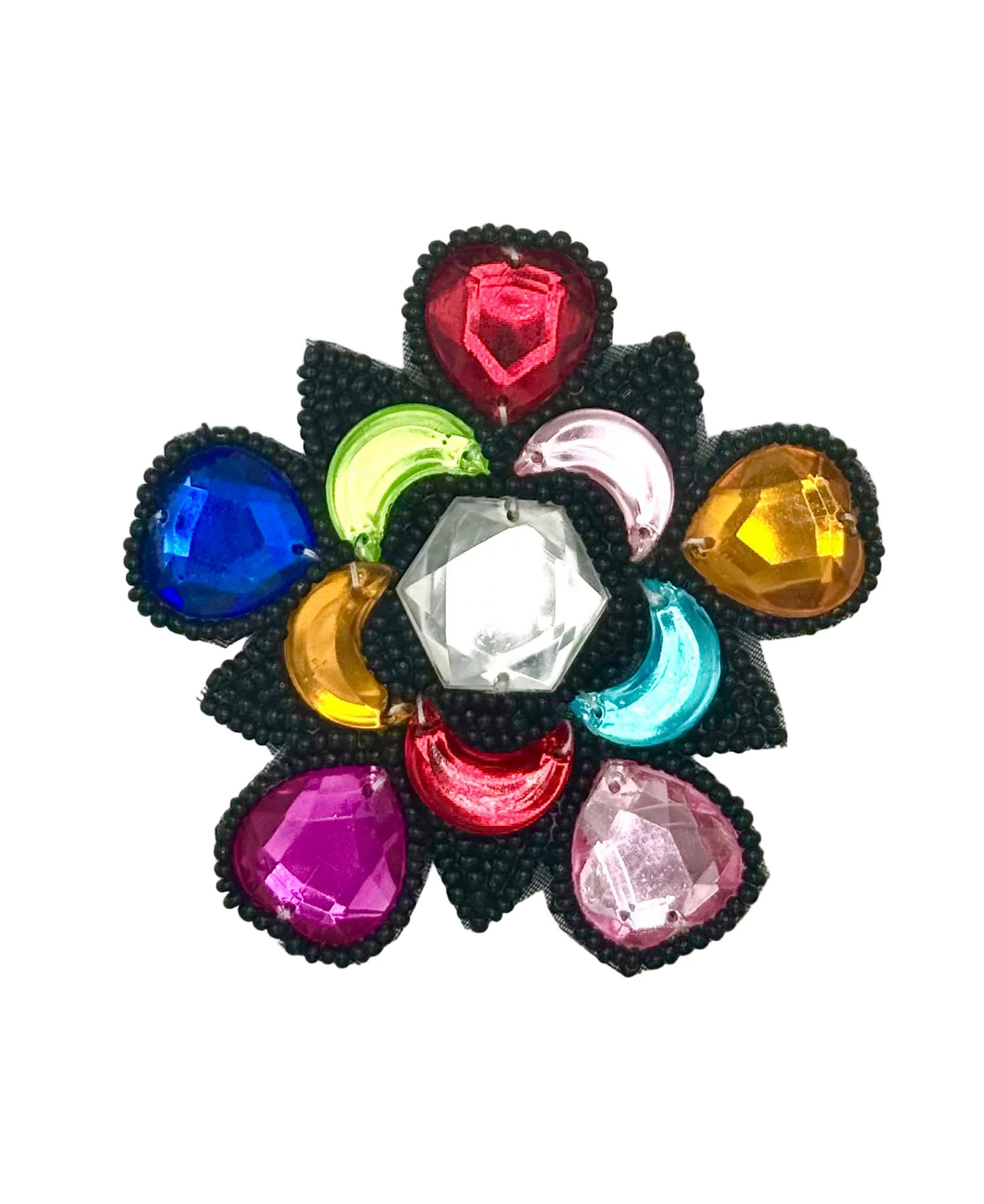 A multicolor flower-shaped rhinestone brooch with a black beaded border and a central clear hexagonal crystal, set against a plain white background.