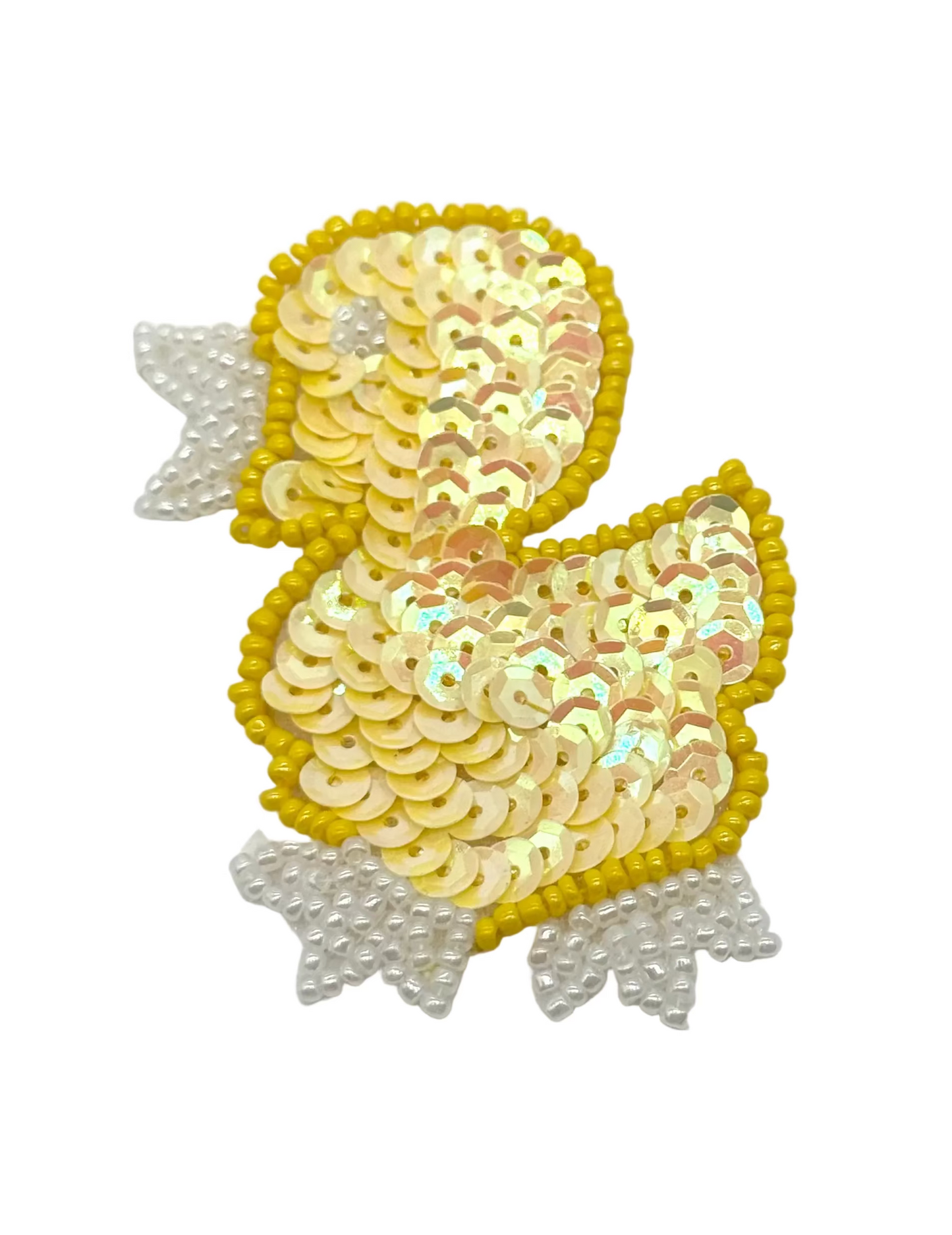 Sequined duck-shaped patch on a white background