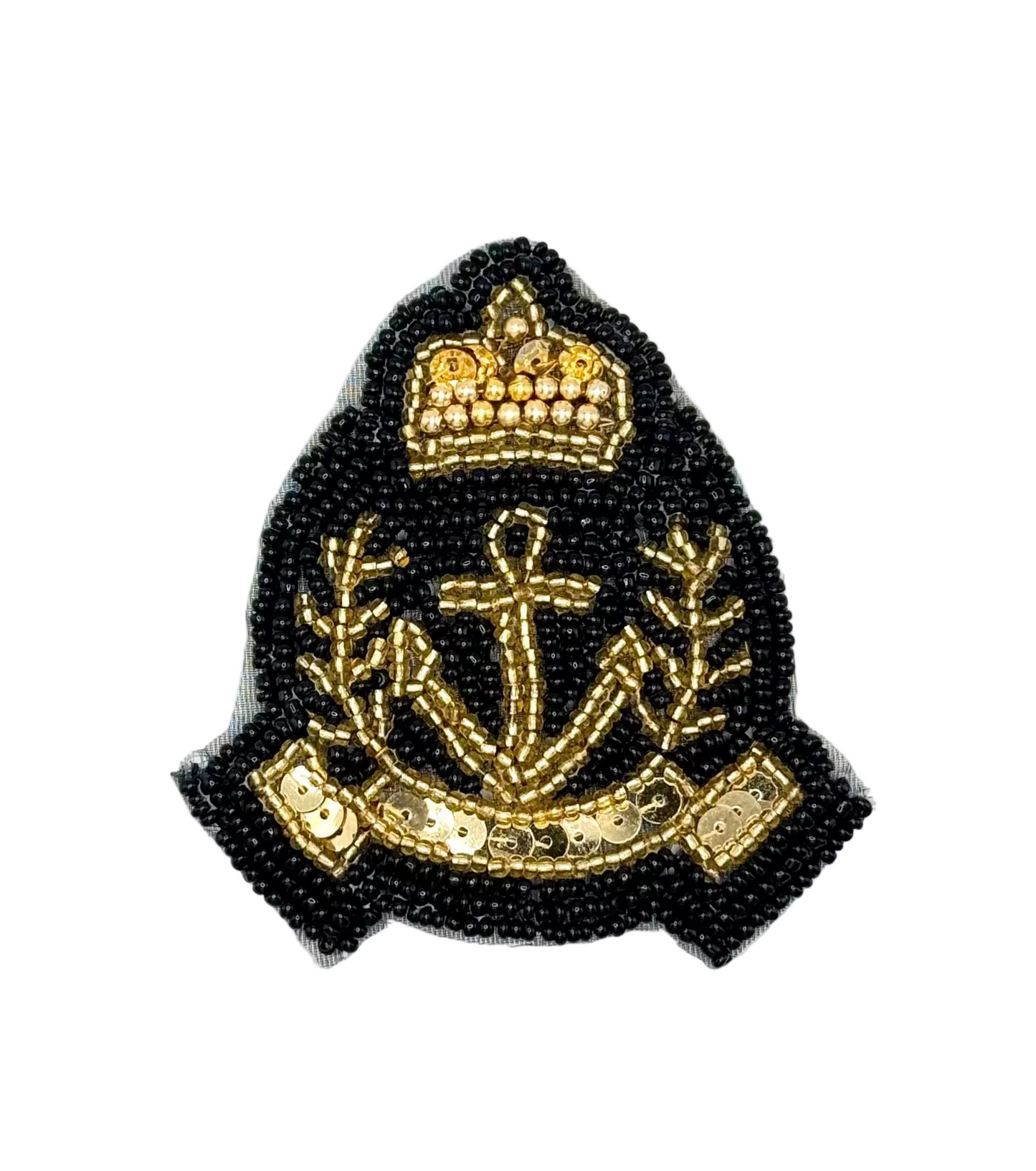 Decorative badge with anchor, crown, and beaded design on a white background