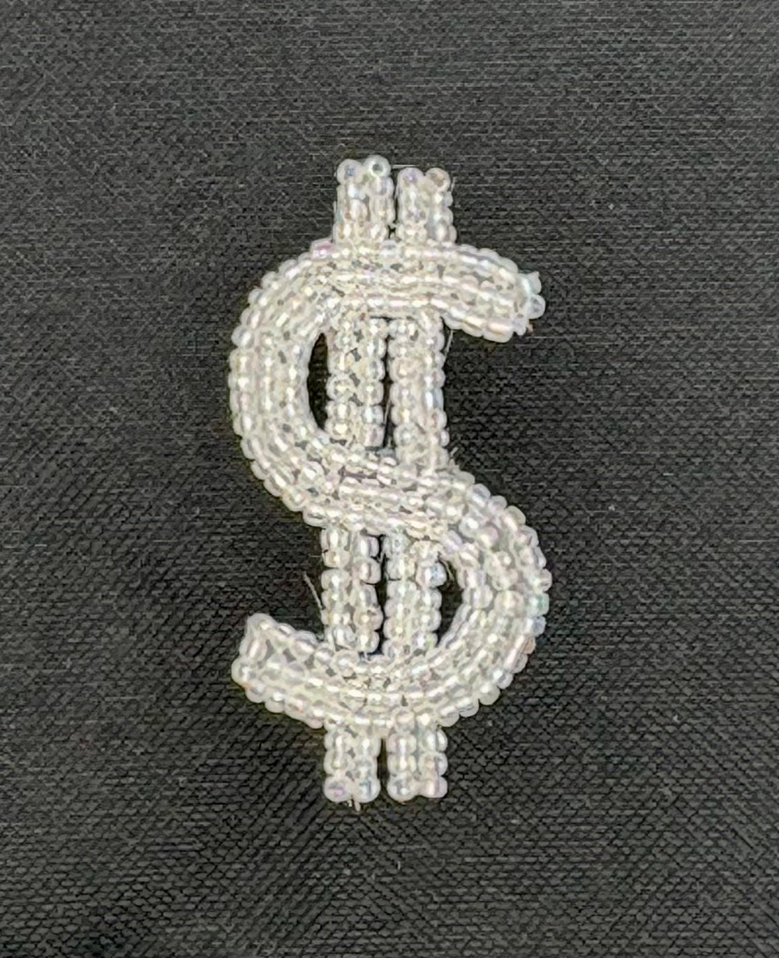 Signo de dólar con cuentas transparentes iridiscentes 7 x 3.8 cm