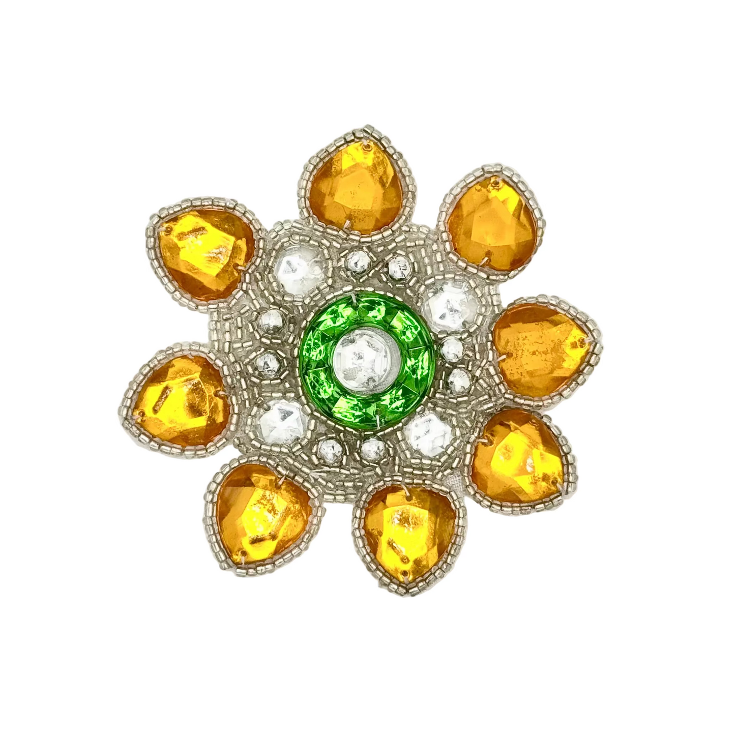 Decorative beaded accent with yellow and green gemstones on a white background