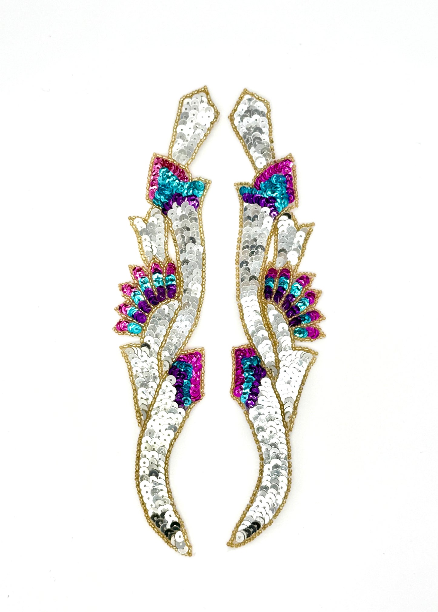 Sequin accent pairs with colorful sequins and gold beads on a white background