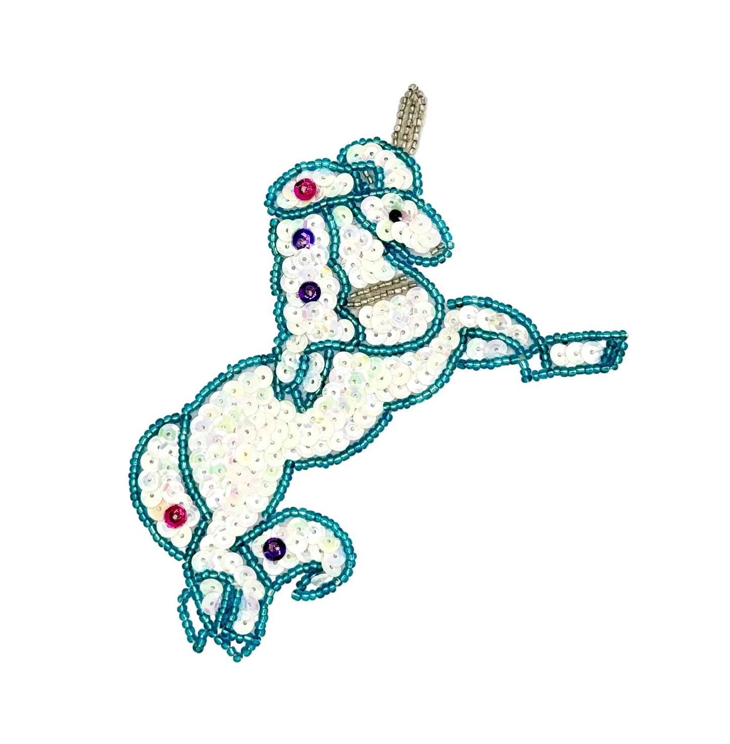 Decorative unicorn patch with sequins and beads on a white background