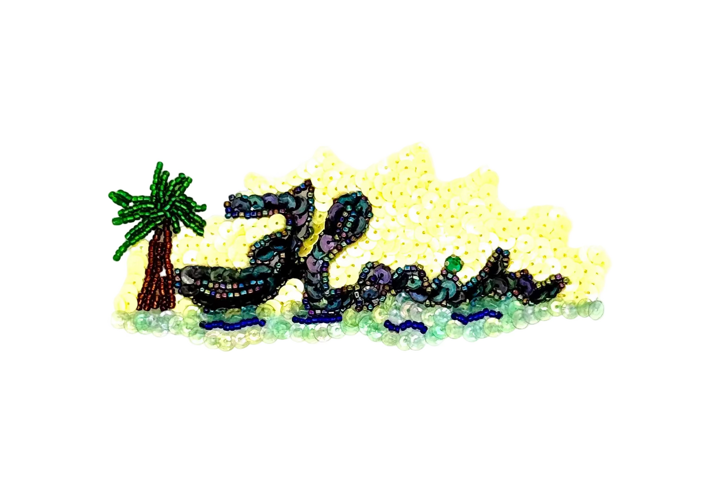 Sequin design of a palm tree and lounge chair with 'Florida' text on a white background
