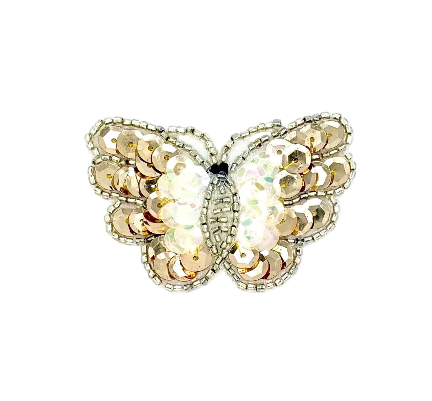 Butterfly-shaped decorative item with sequins and beads on a white background