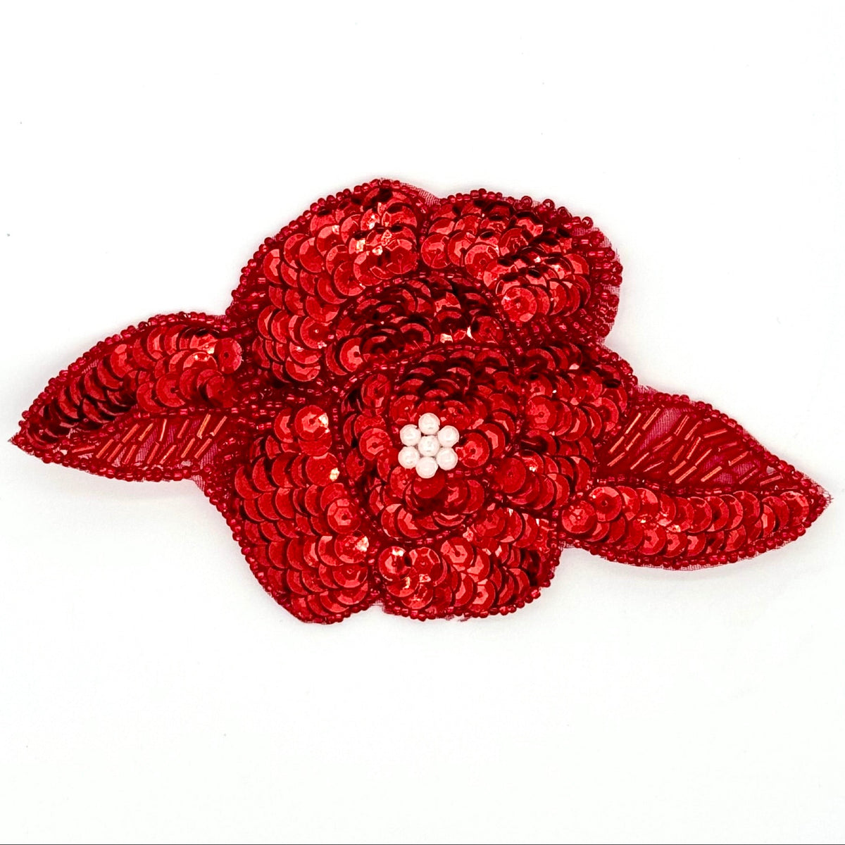 Red sequin flower patch on a white background