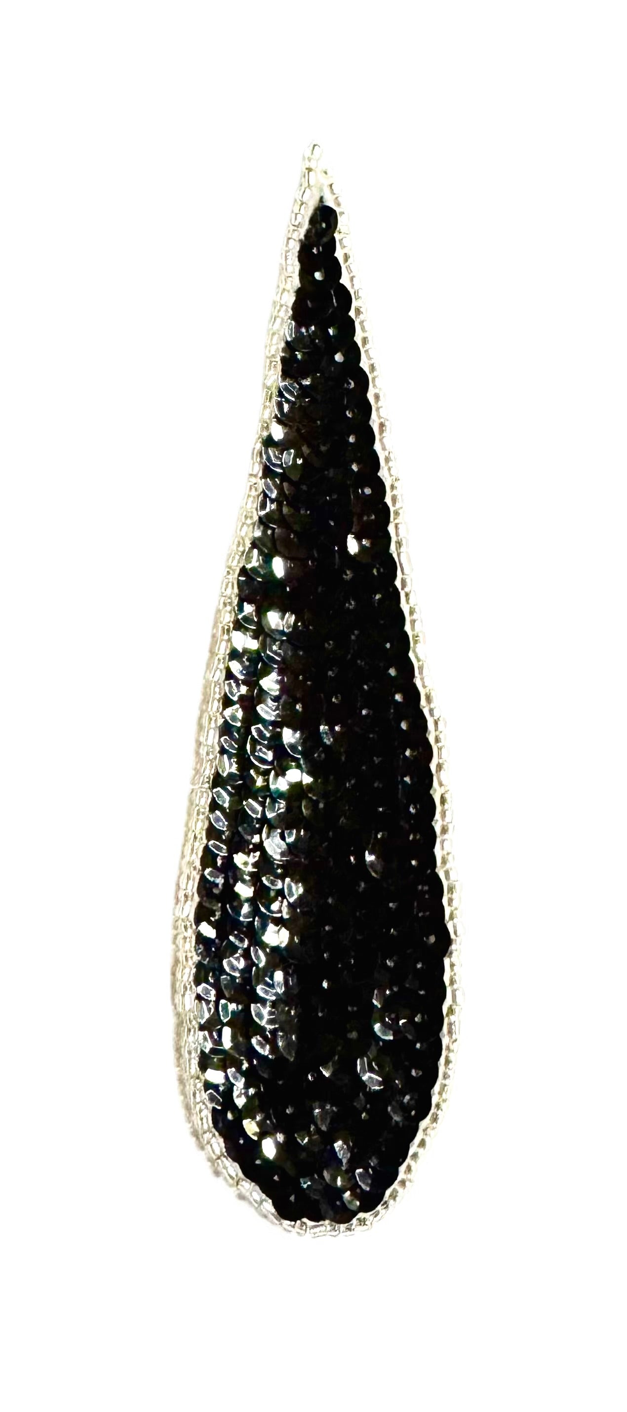 A teardrop-shaped black sequin embellishment with a silver glass bead border, shown against a plain white background.