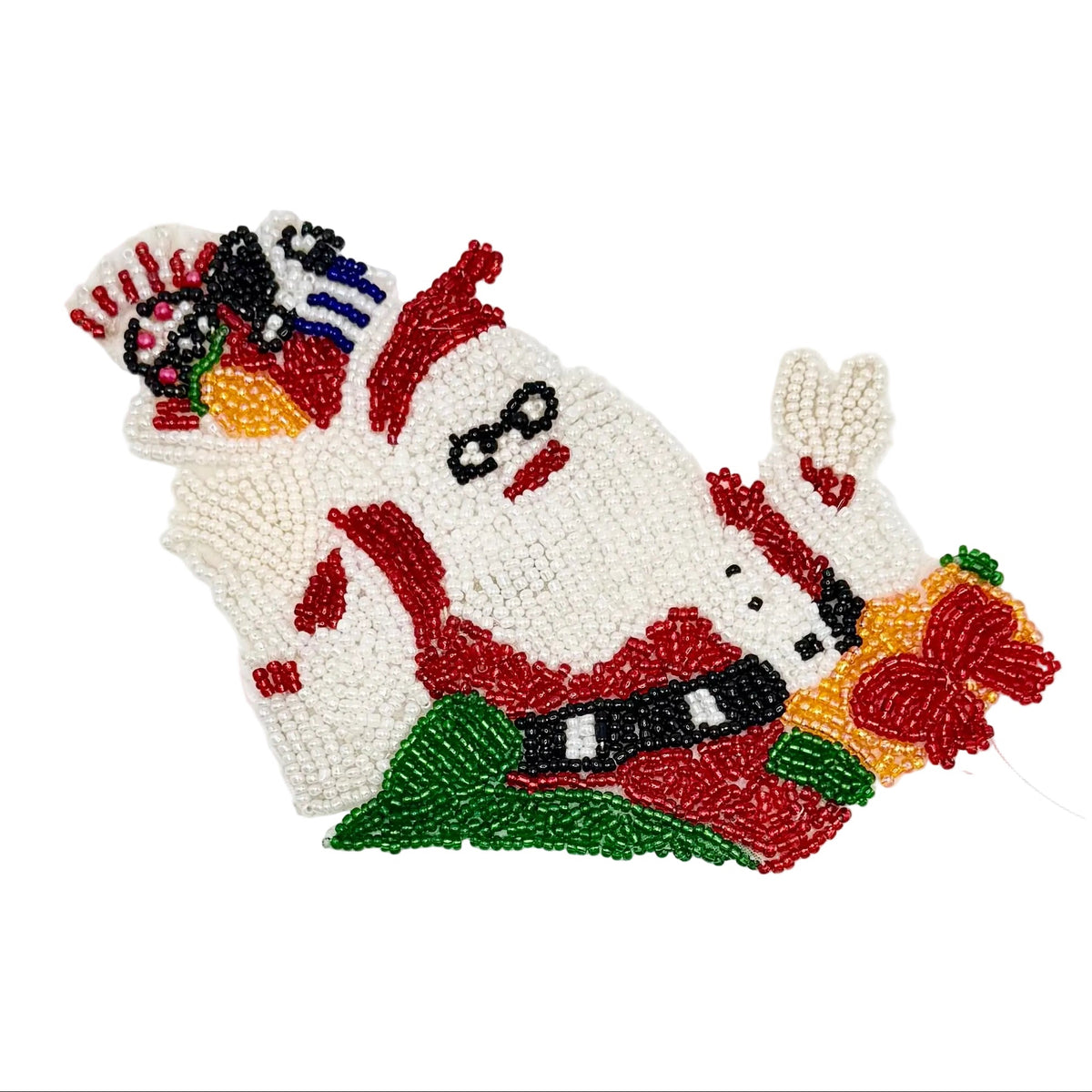A hand-beaded decorative patch or applique featuring a stylized Santa Claus face and holiday motifs, crafted with white, red, green, yellow, black, and blue beads on a plain white background.
