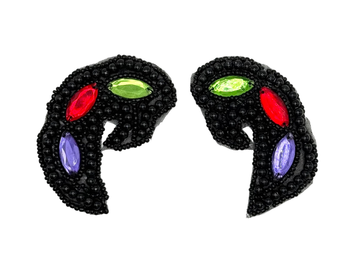 A pair of black beaded crescent-shaped appliqués with colorful gemstone accents in red, green, and purple, displayed on a plain white background.