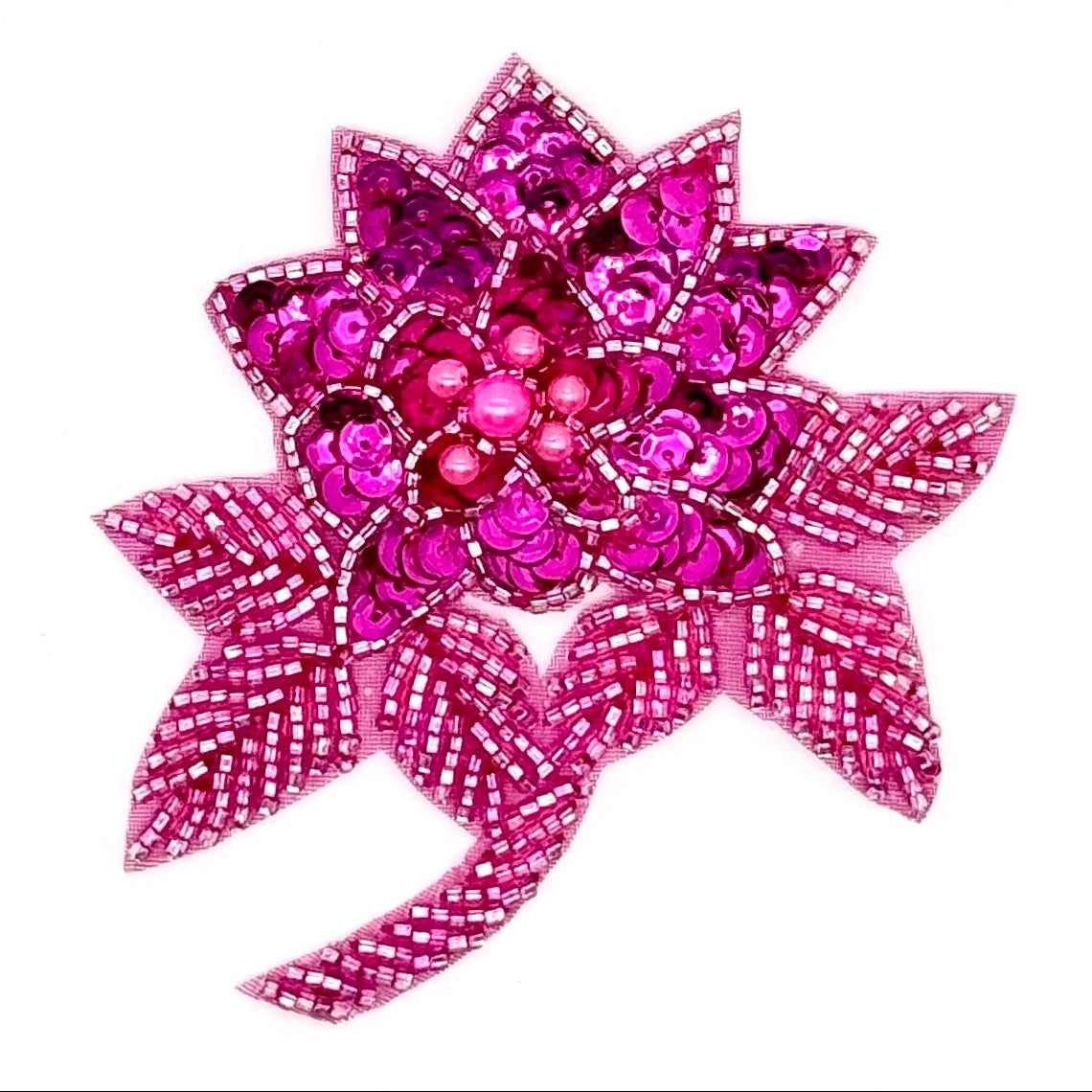 Flor fucsia con lentejuelas fucsia y cuentas y perlas rosas 10 x 9 cm