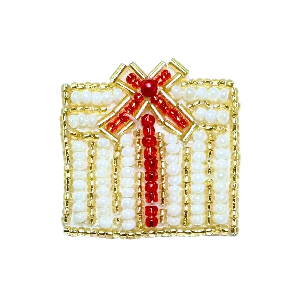 Decorative beaded Christmas present with pearls and red accents on a white background