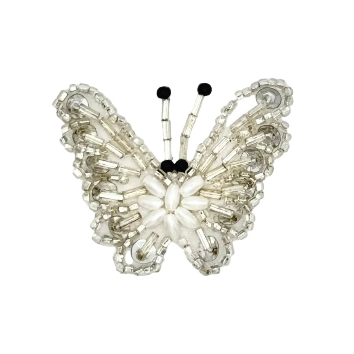 A butterfly-shaped appliqué made from silver-toned glass beads, silver sequins and small black beads for the antennae, shown on a plain white background.