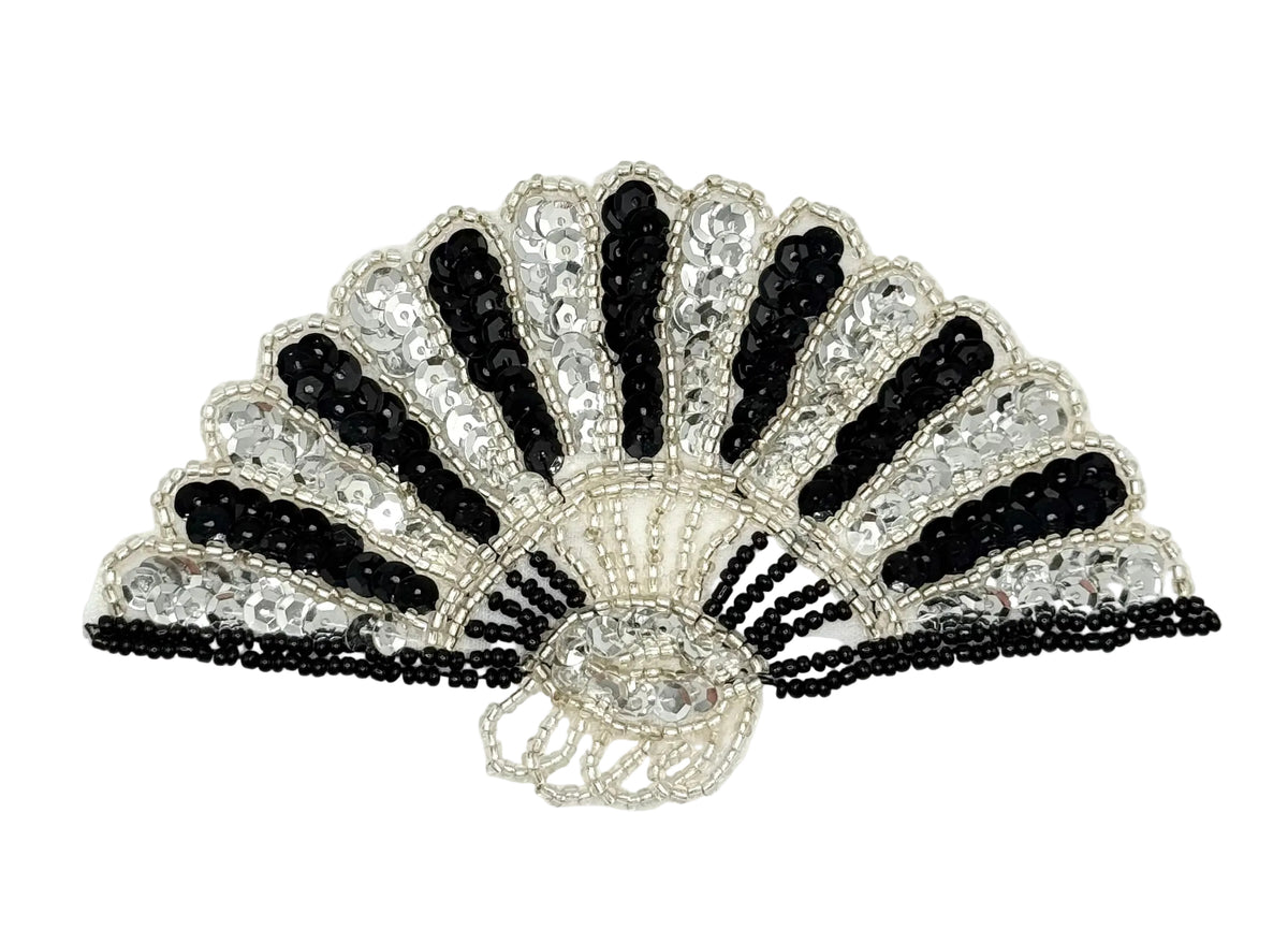 A sequin and bead fan appliqué featuring black and silver beads, sequins, and fringe details on a white background.