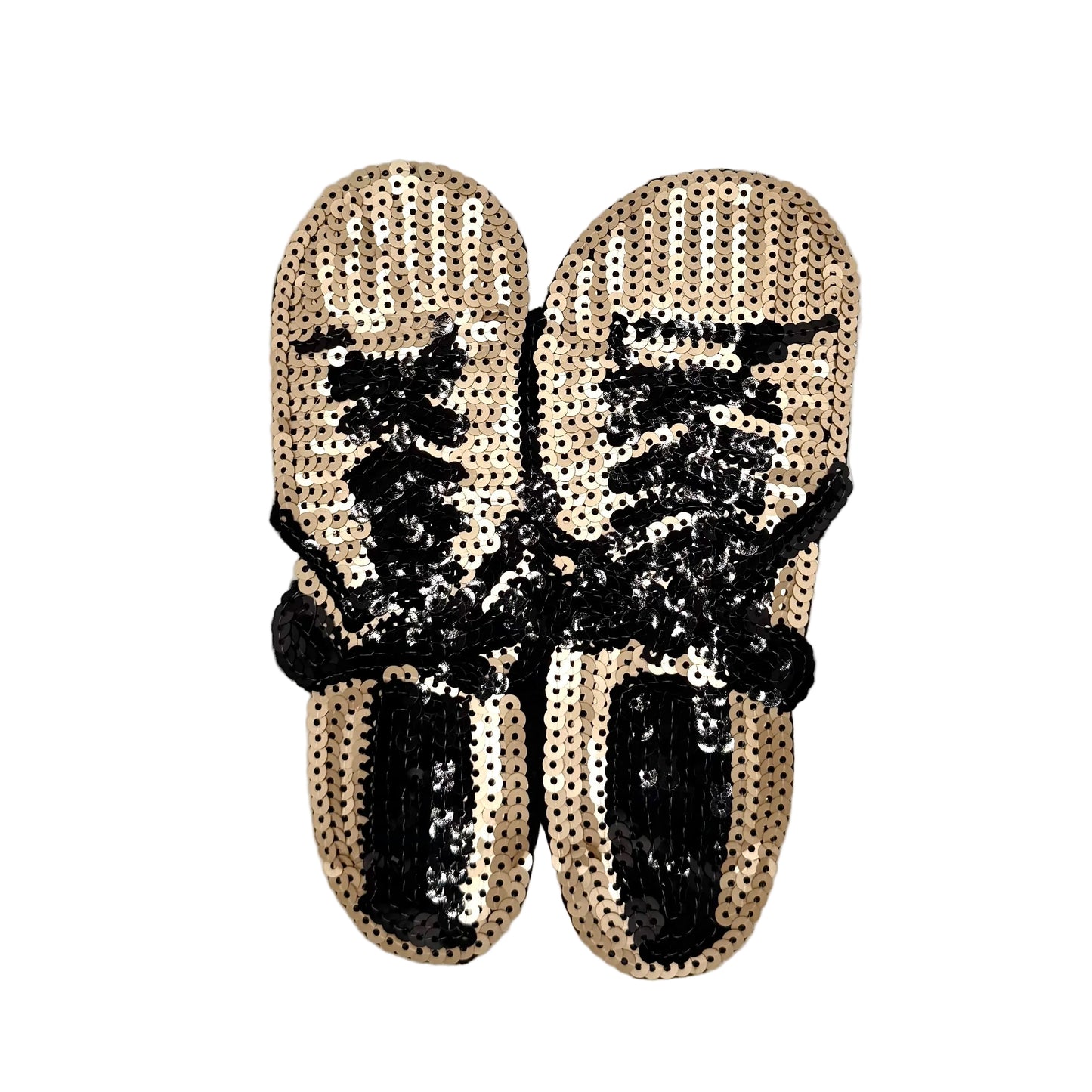 A pair of gold and black sequin sneakers on a white background.
