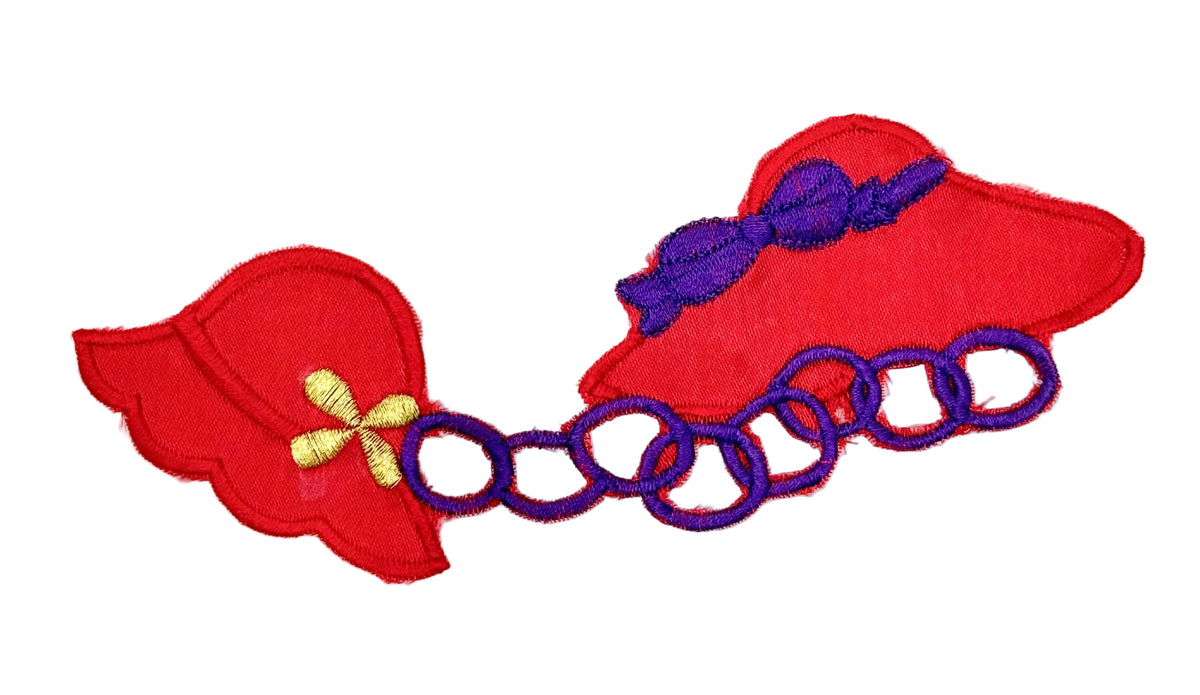 Two embroidered red hats connected by purple chain links, with a purple bow on one piece and a small gold flower detail on the other, shown on a plain white background.