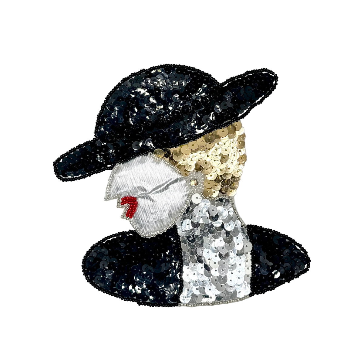 A sequined fashion accessory or patch depicting a woman in profile, wearing a black sequined hat and matching hatband, a silver face, gold sequins in the hair, a silver sequined dress, and small red lips, shown on a plain white background.