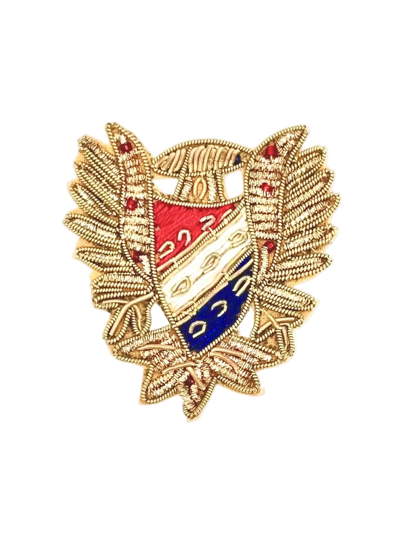 A gold bullion thread embroidered military-style crest featuring a central shield with red, white, and blue sections, set against a plain white background.
