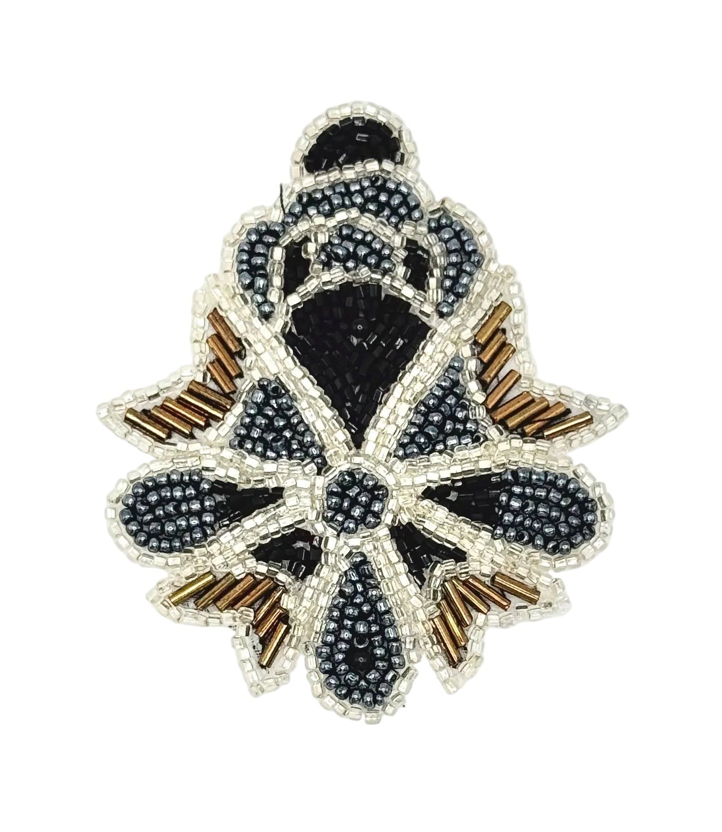 A decorative beaded patch featuring a stylized geometric design in black, gray, silver, and metallic bronze beads on a plain white background.