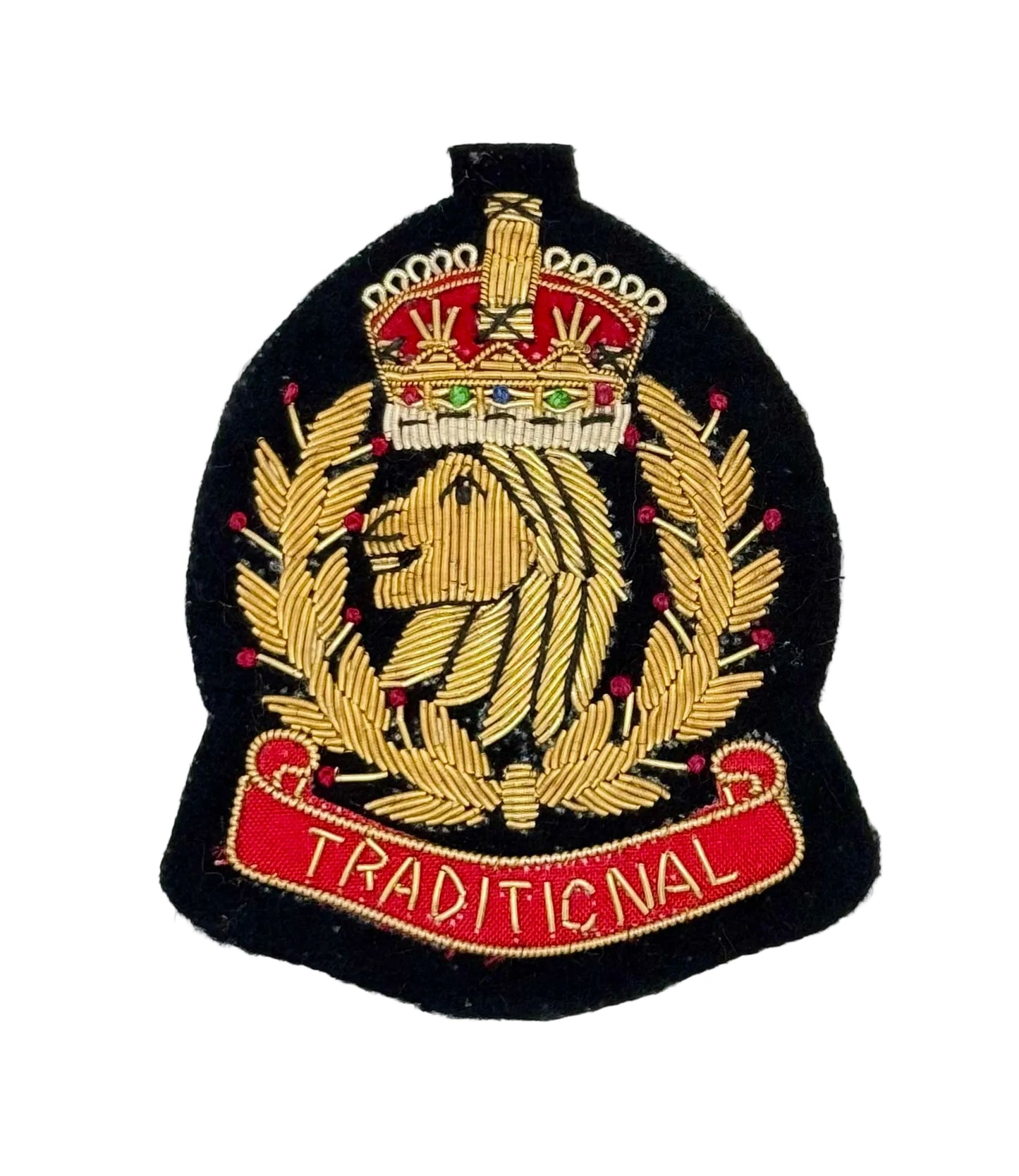 An embroidered traditional crest patch featuring a gold lion and wreath on a black background, topped with a red and gold crown, and finished with a red scroll reading 'TRADITIONAL'.