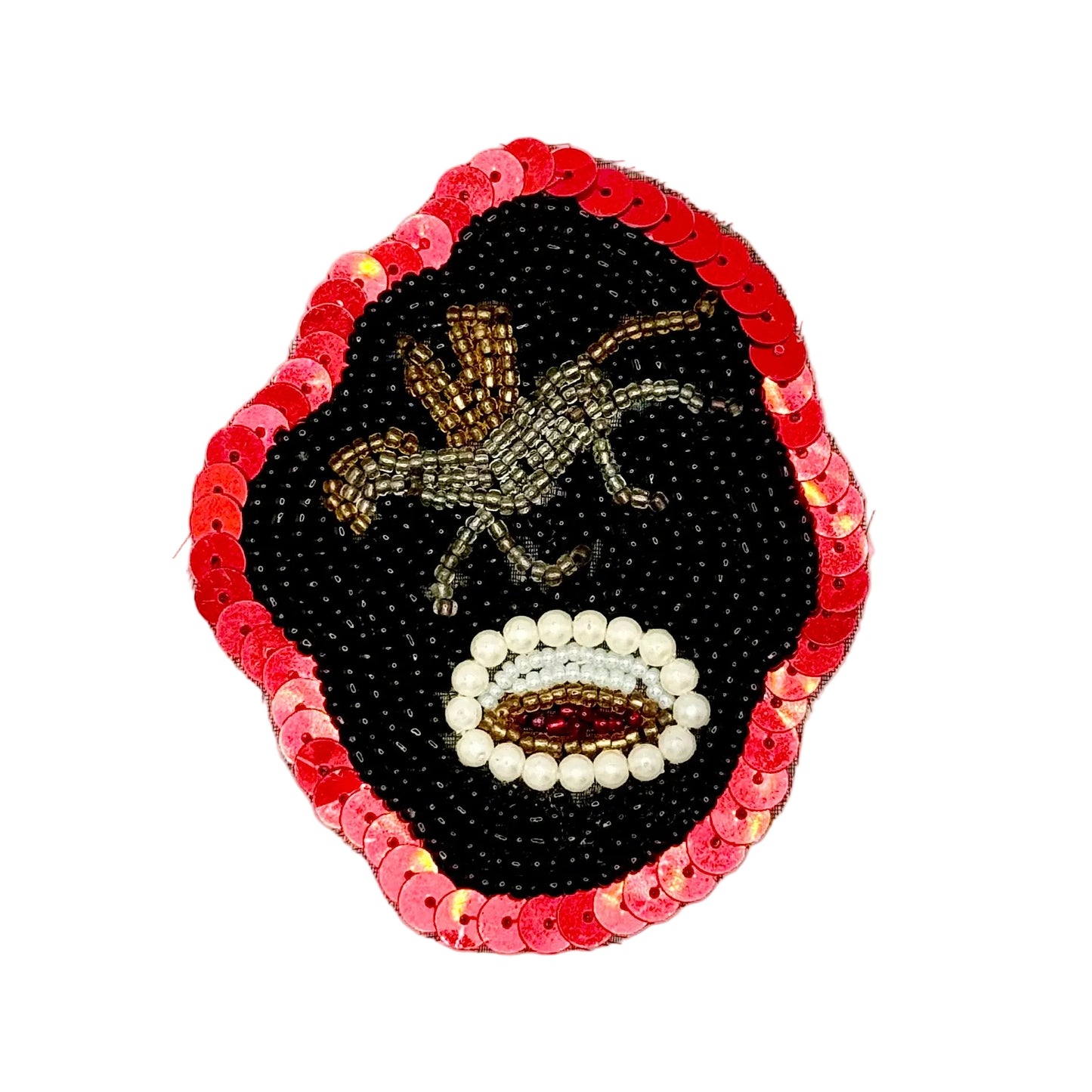 A handcrafted beaded and sequined patch featuring a stylized face. The design has a black beaded center with a gold-toned pegasus motif and a white beaded open eye, all framed by a red sequined border on a white background.
