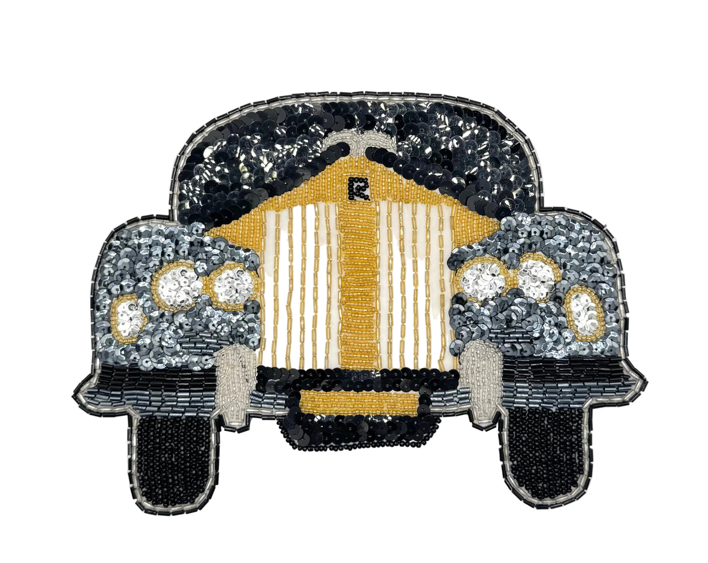 A vintage sequin and bead patch depicting the front view of a vintage car, featuring a prominent gold and white striped grille with a small 'R' emblem, flanked by silver and black headlight sections, all on a plain white background.