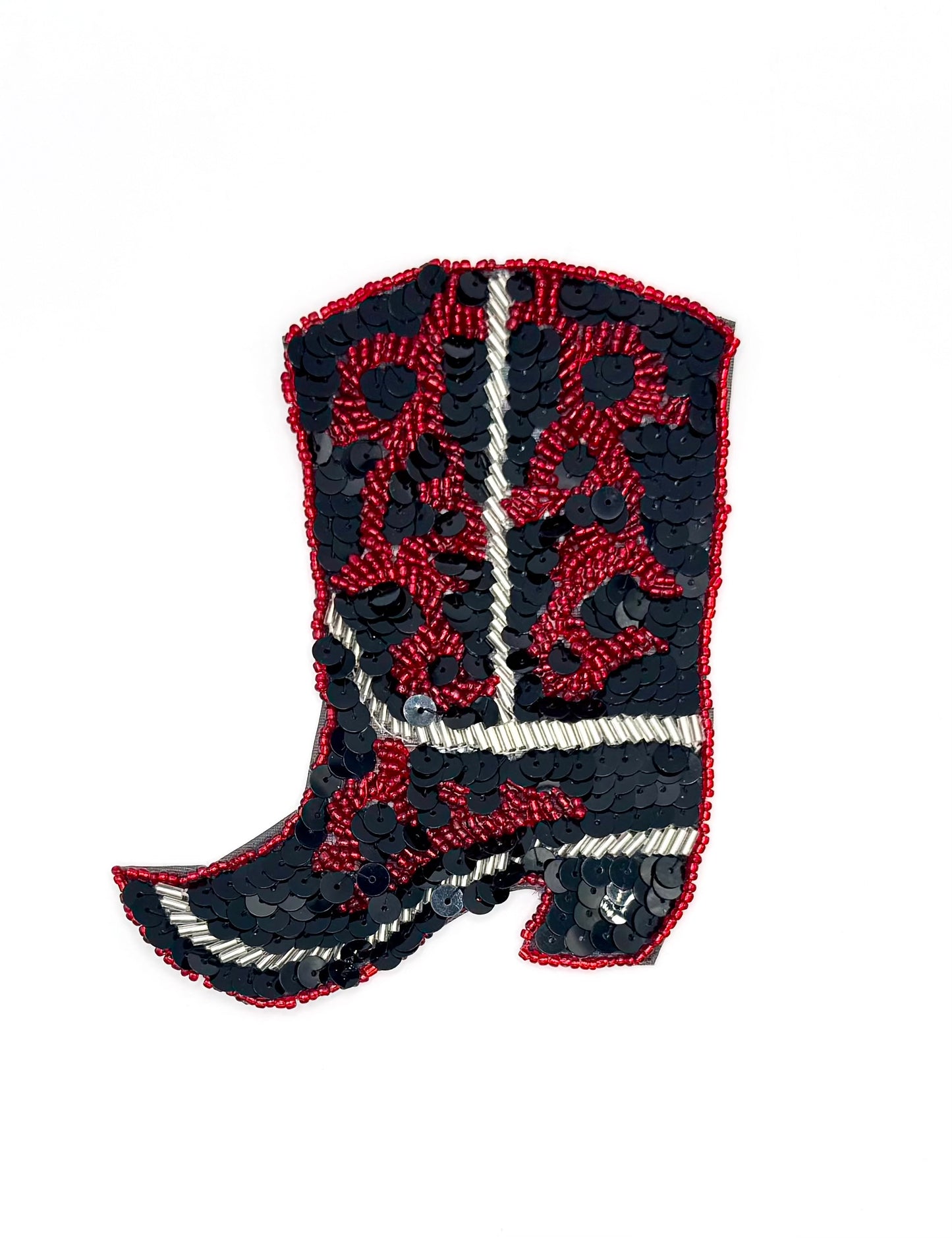 Decorative patch of a cowboy boot with red and black sequins and beads on a white background