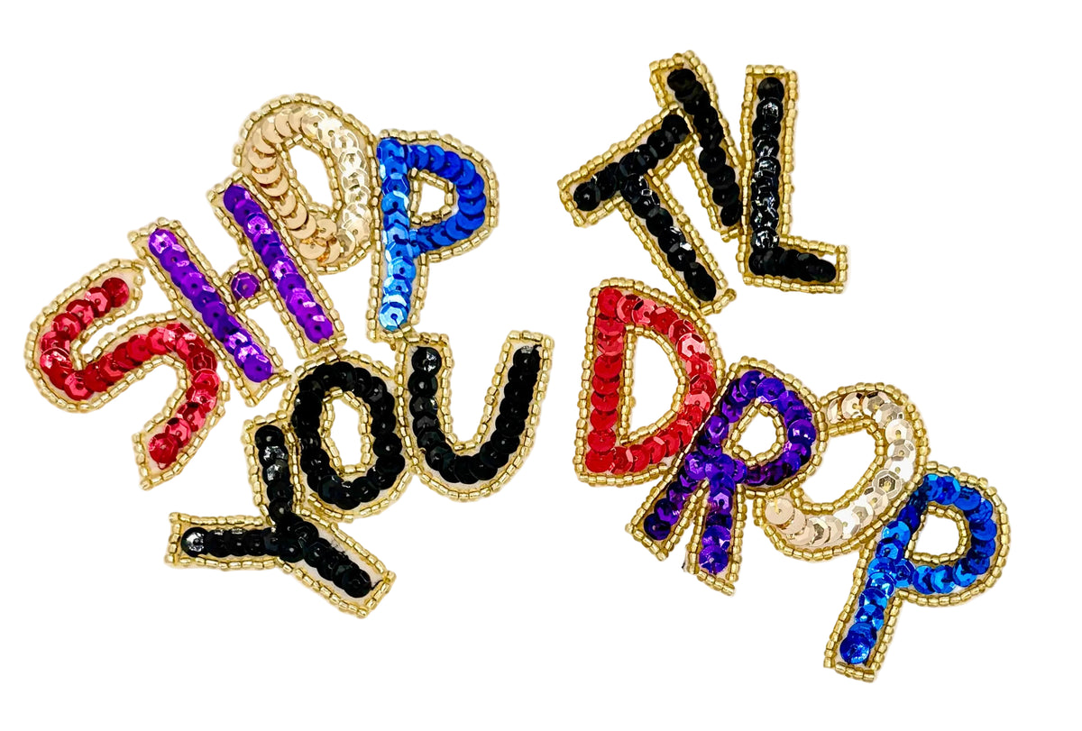 Colorful sequin letters spelling 'SHOP TIL YOU DROP' on a white background