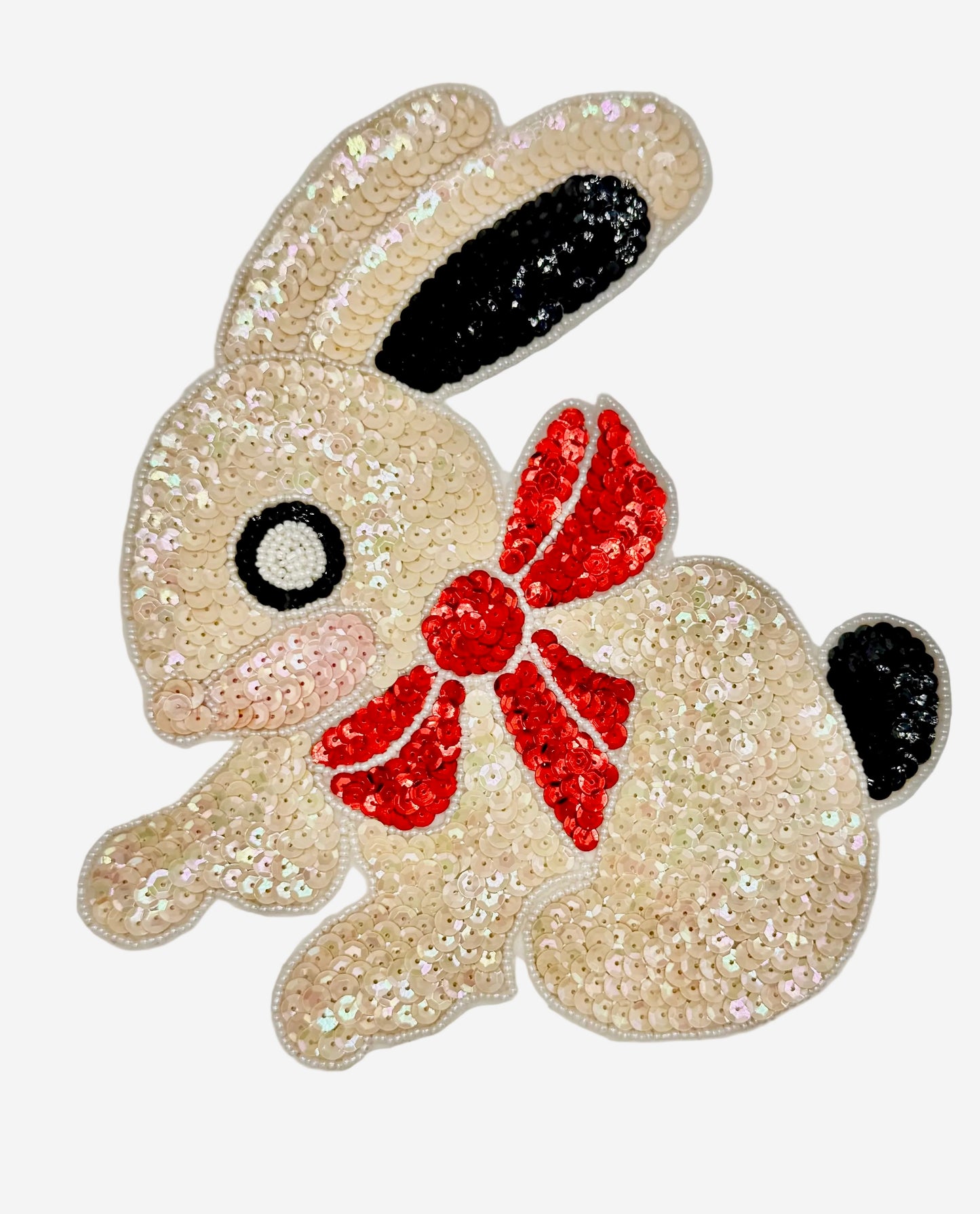 Sequined bunny with a red bow on a white background