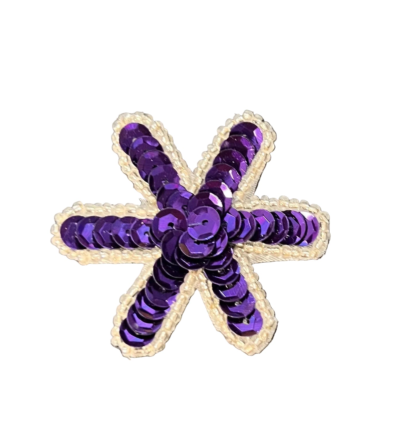 Purple star-shaped patch with sequins on a white background