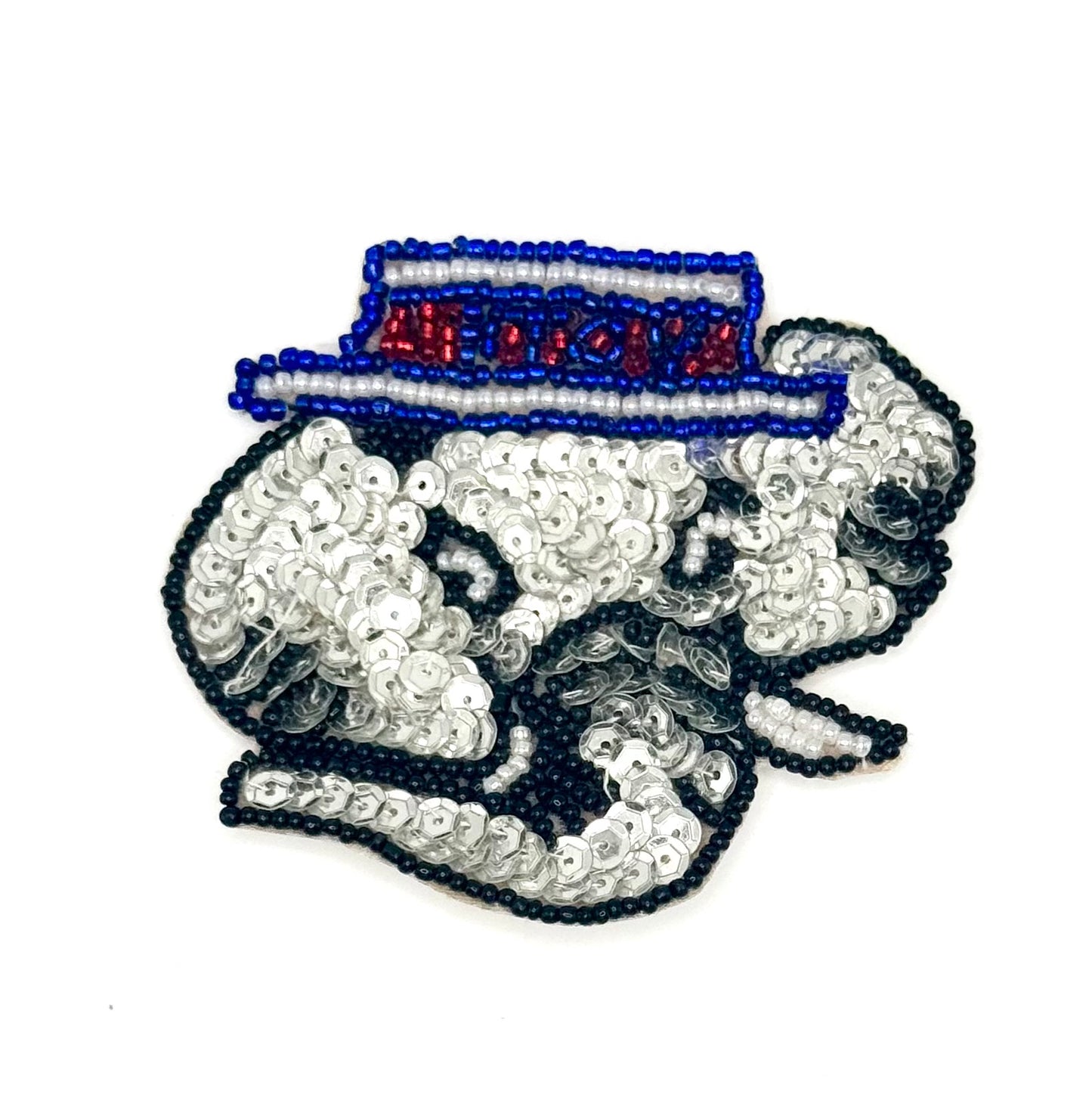 Decorative patch with sequins and beads on a white background