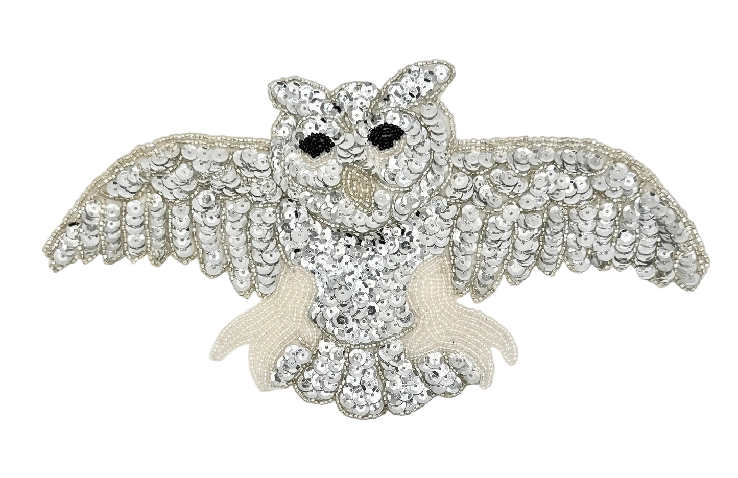 Decorative owl patch with sequins and beads on a white background