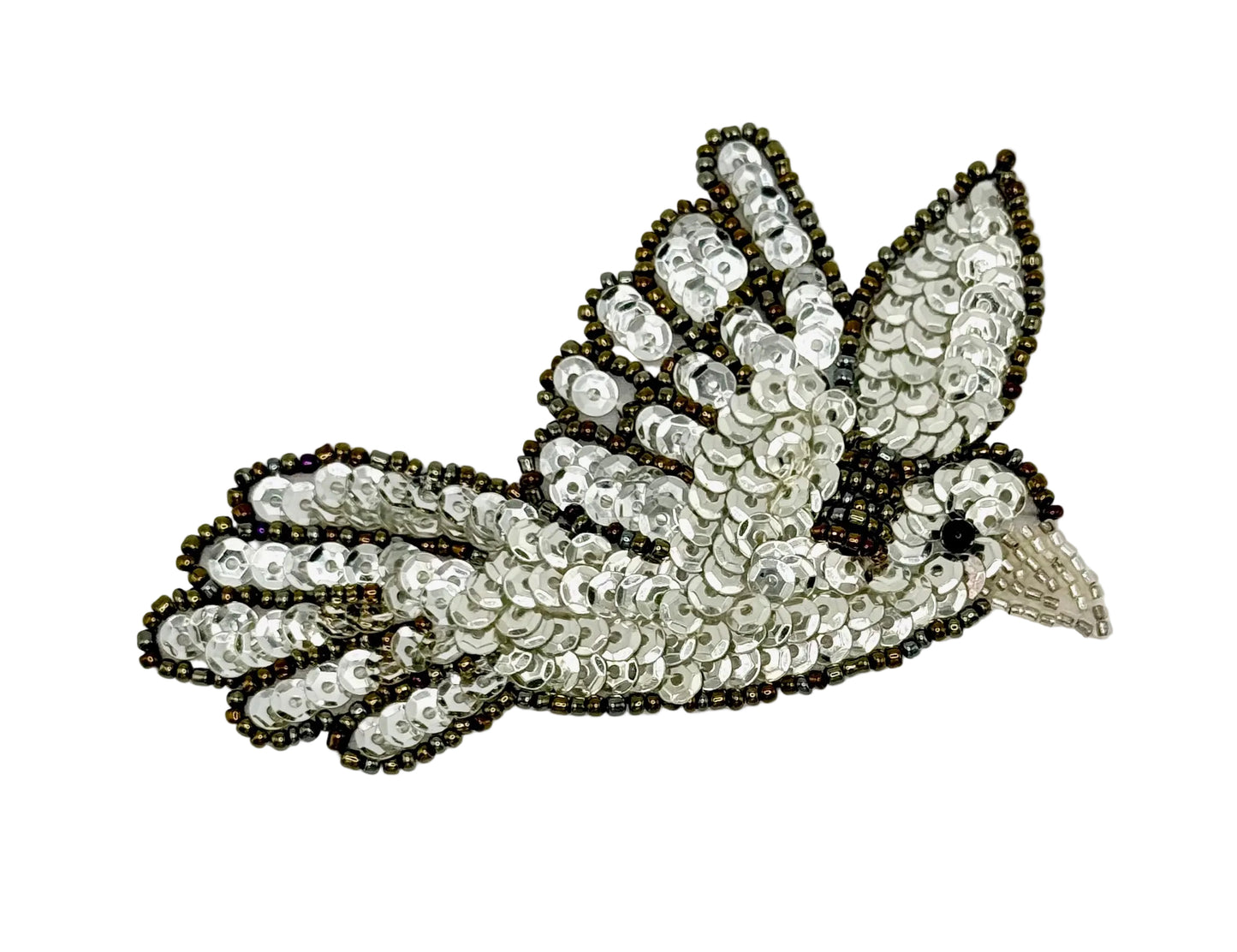 Decorative dove patch with sequins and beads on a white background