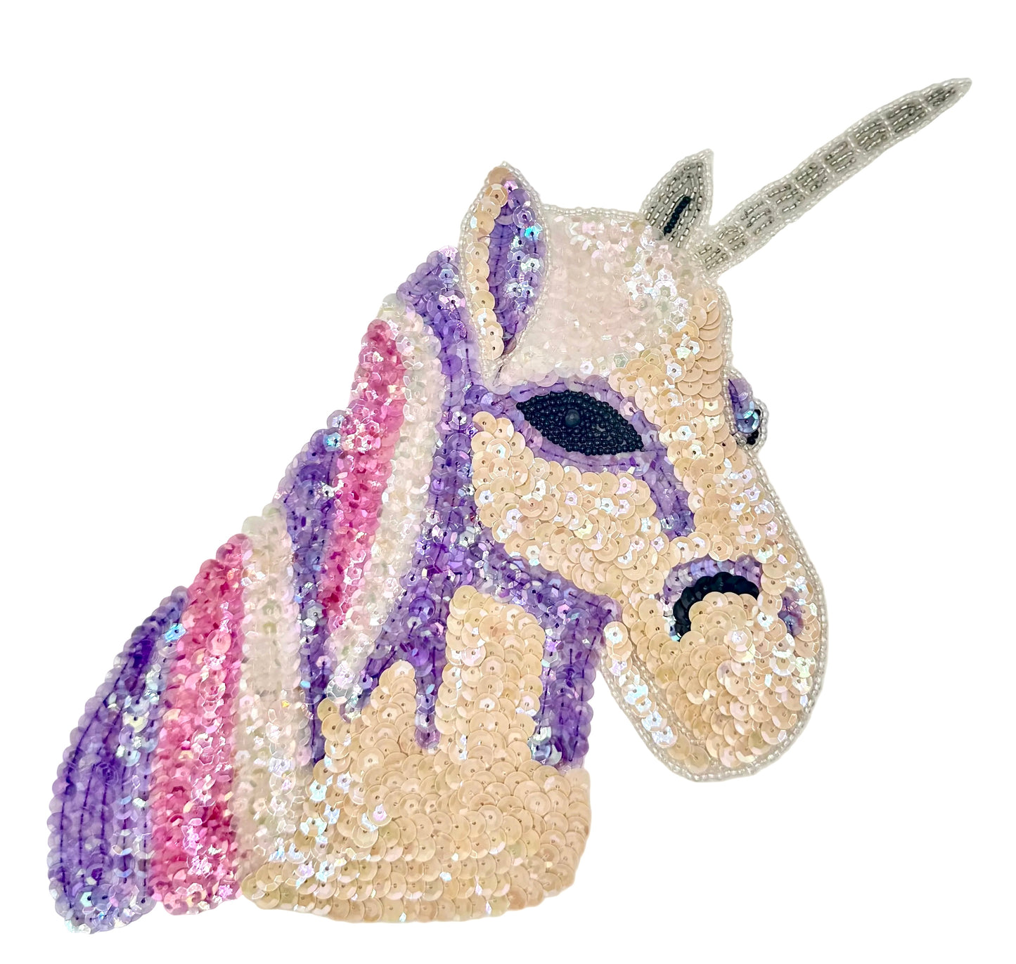 Sequined unicorn head with a white background
