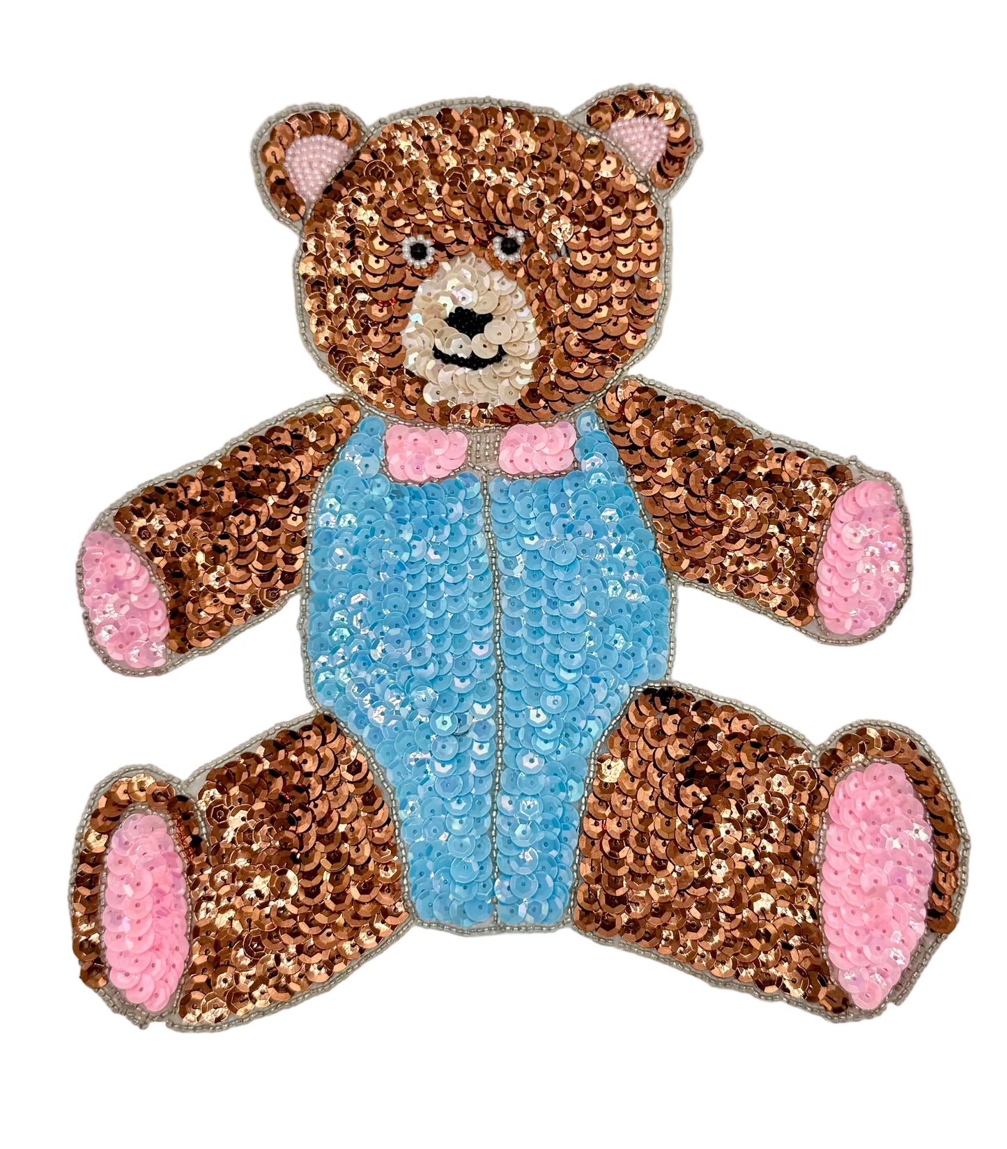 Sequined teddy bear with a blue outfit on a white background