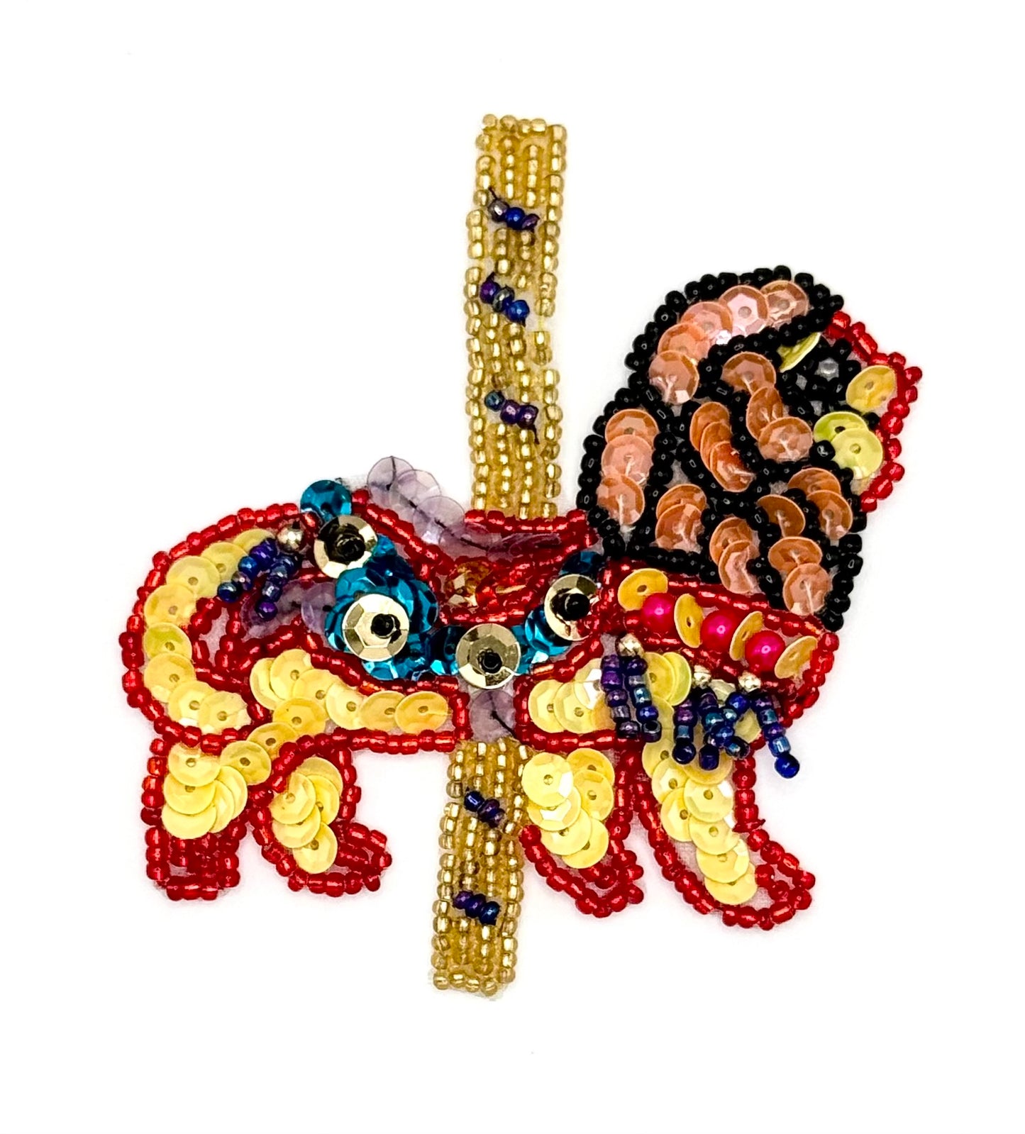Beaded carousel lion with colorful sequins and beads on a white background