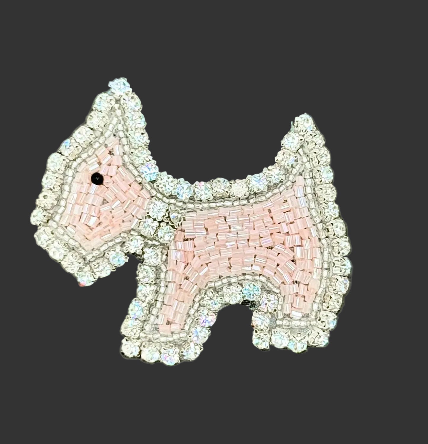Pink Scottie dog with Glass Beads and rhinestones on a dark background