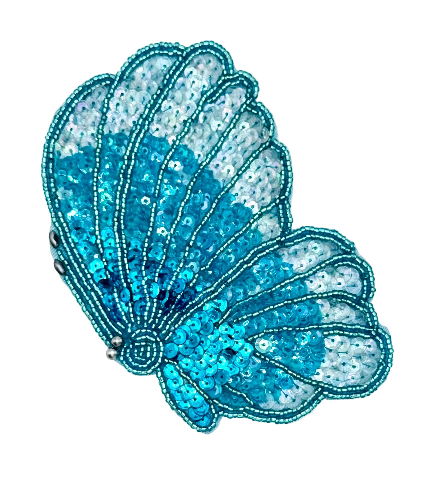 Flying turquoise butterfly with sequins and beads on a white background