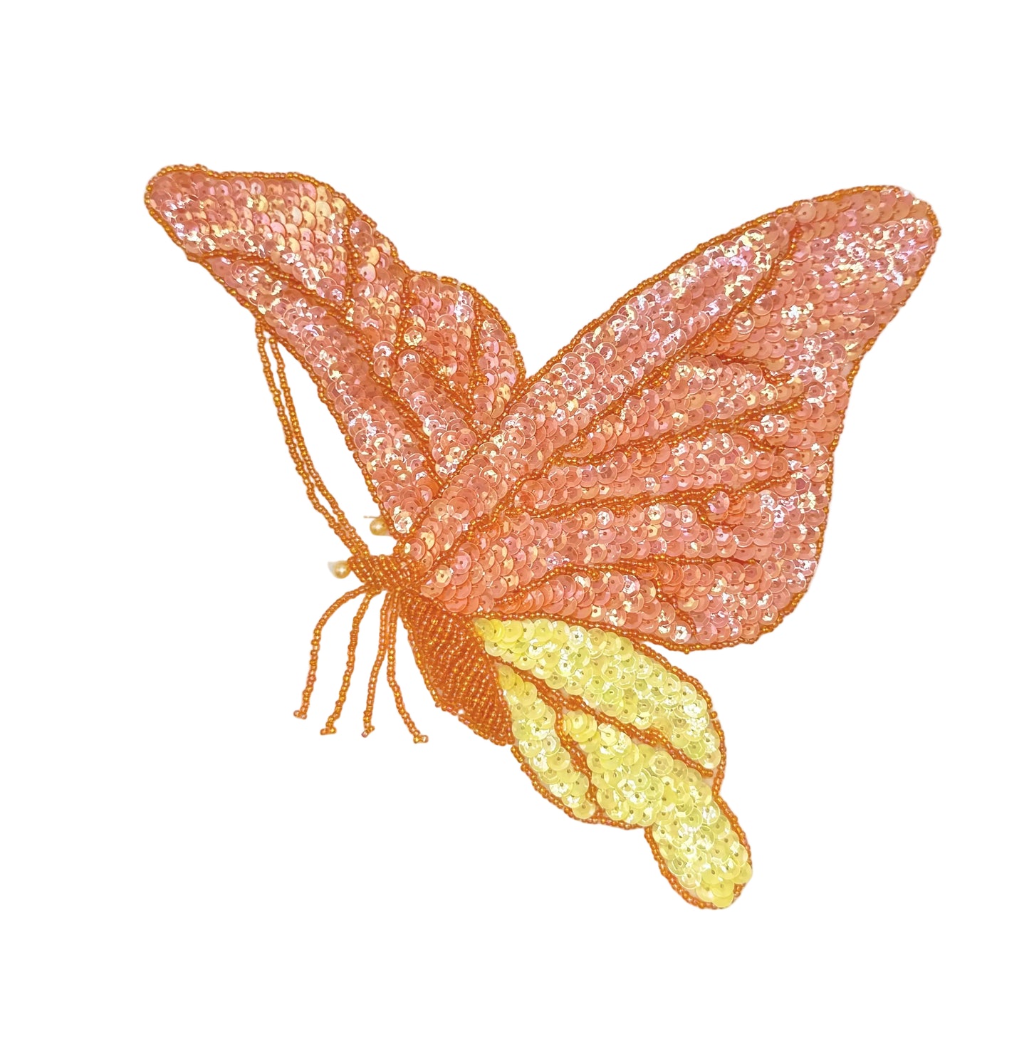 Butterfly-shaped patch with orange and yellow sequins and beads on a white background