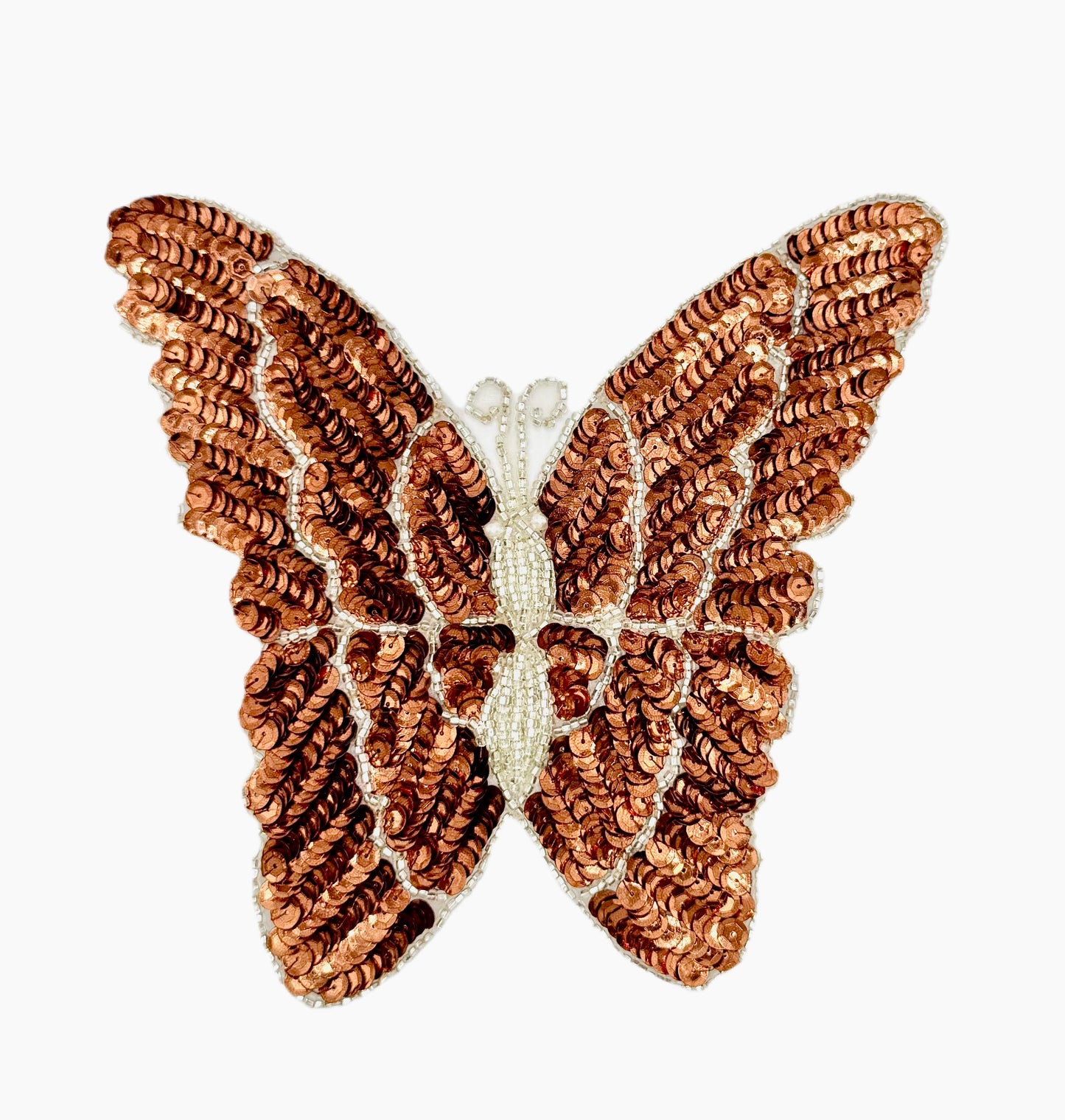 Butterfly-shaped decorative patch with sequin details on a white background