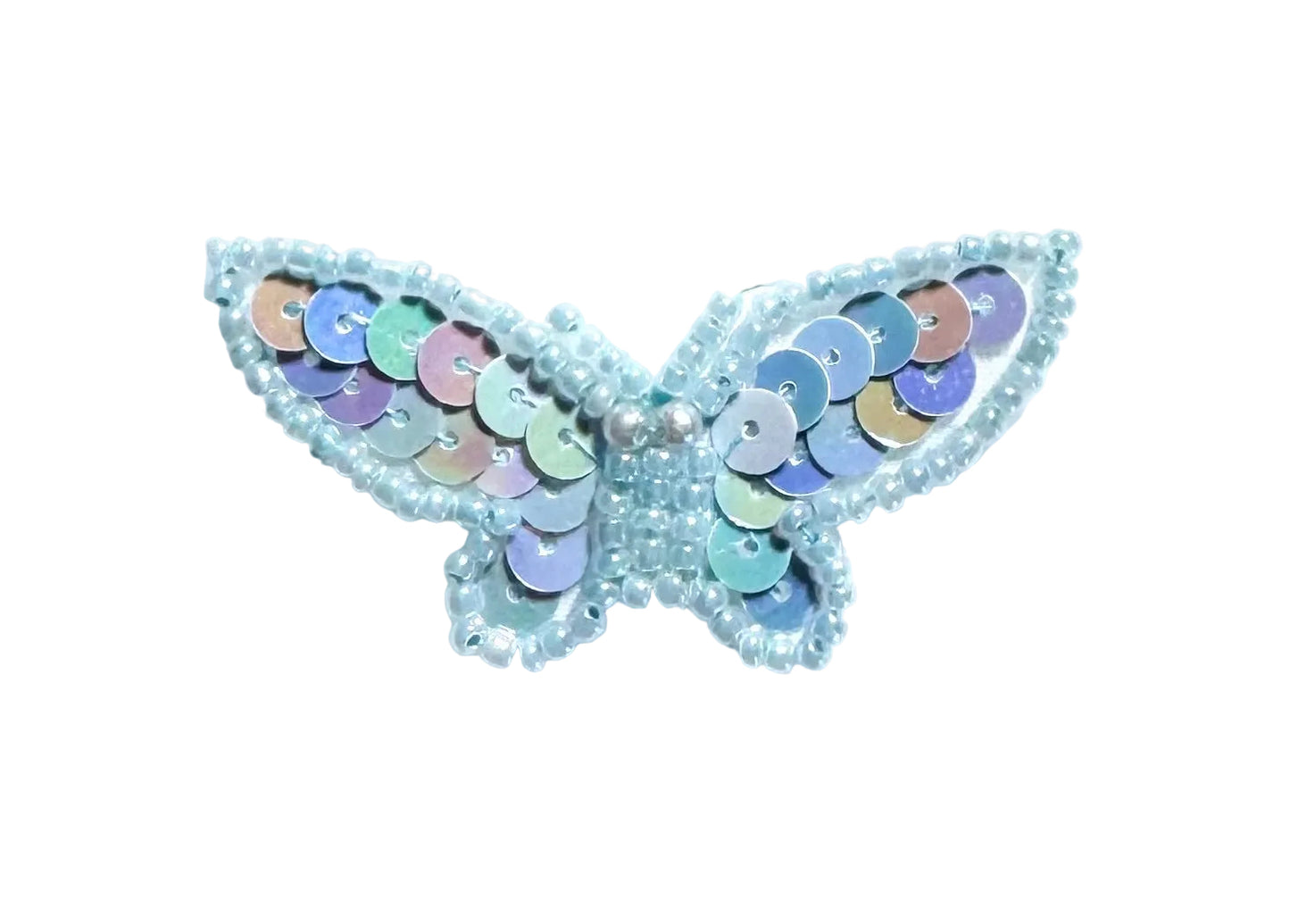 Butterfly-shaped patch with sequins on a white background