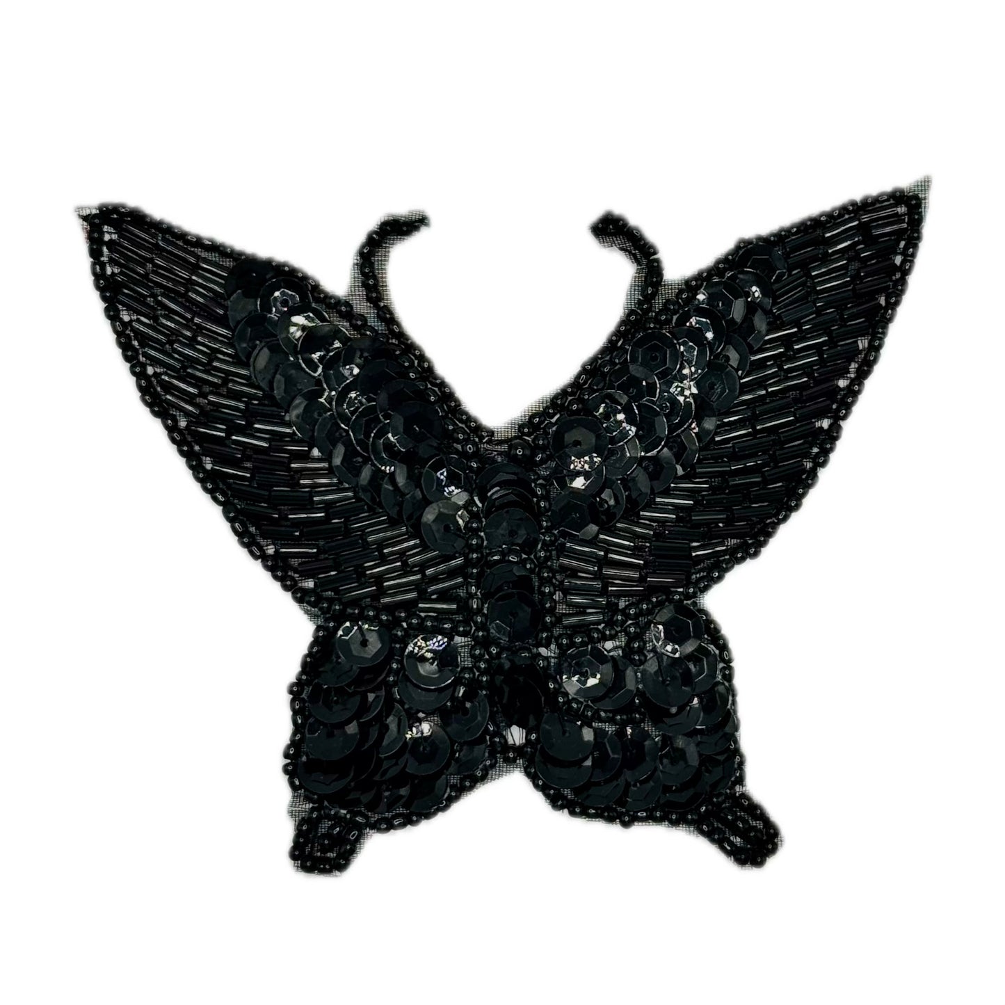 Black butterfly-shaped patch with sequins on a white background
