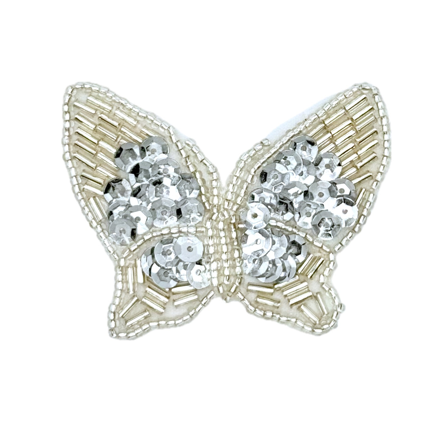 Butterfly-shaped decorative item with silver sequins on a white background