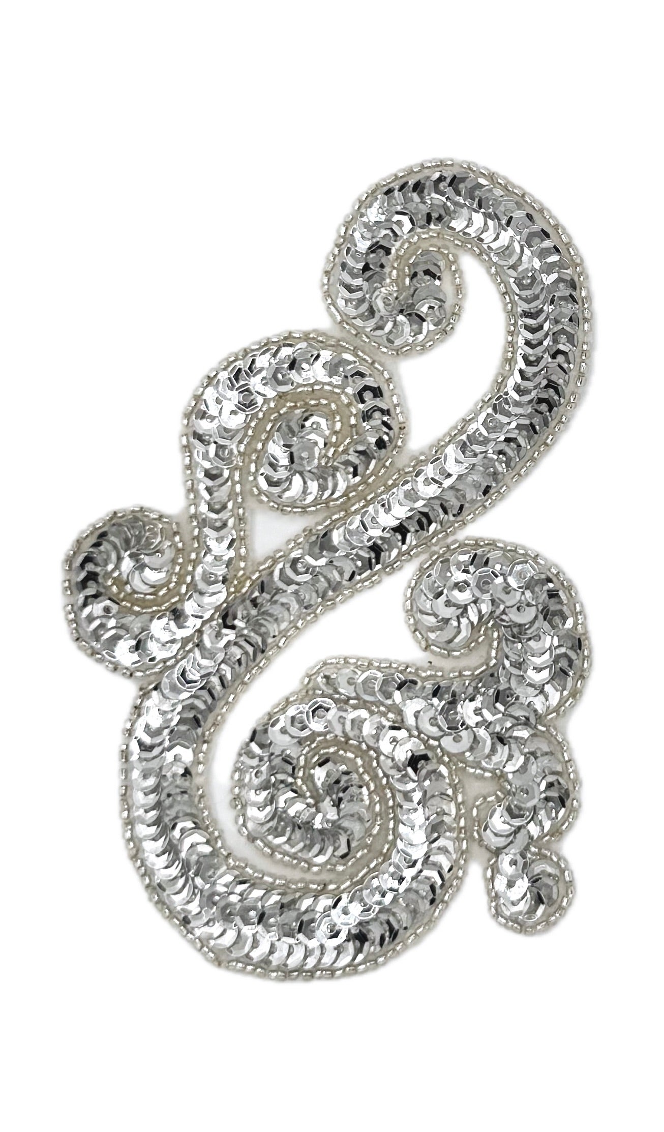 Silver sequin and bead accent with intricate designs on a white background