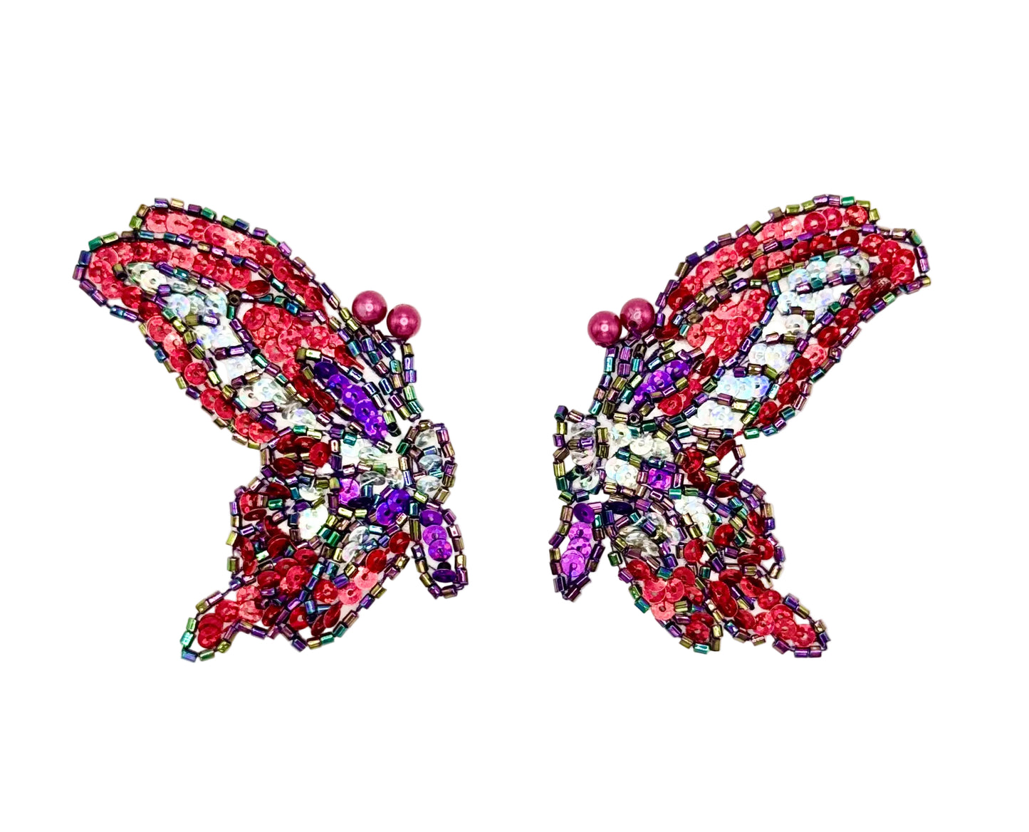 Butterfly-shaped sequin and bead pair on a white background