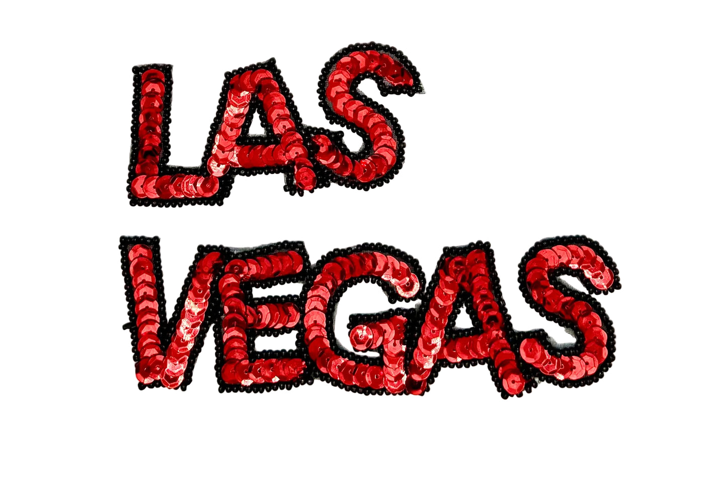 Red sequin 'LAS VEGAS' text on a white background