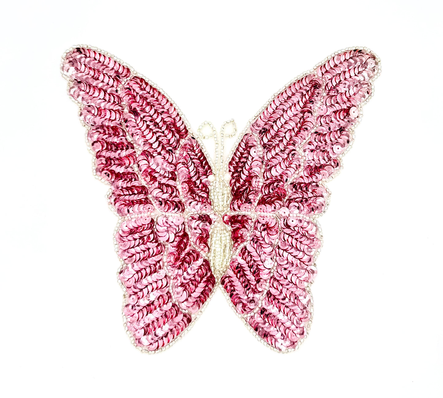 Pink butterfly-shaped patch on a white background