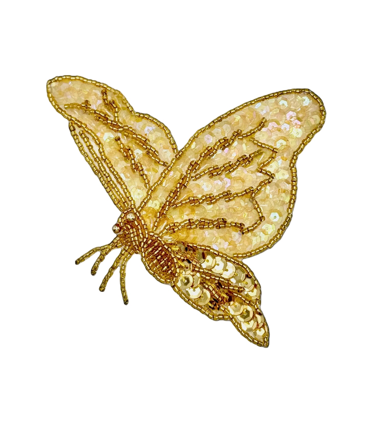 Gold butterfly-shaped decorative item on a white background