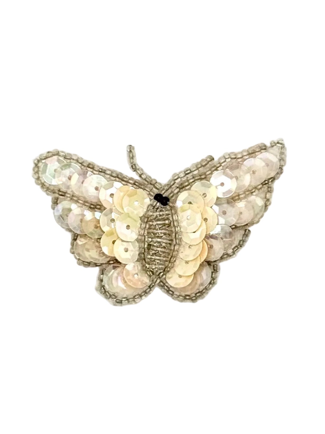 Butterfly-shaped patch with sequins on a white background