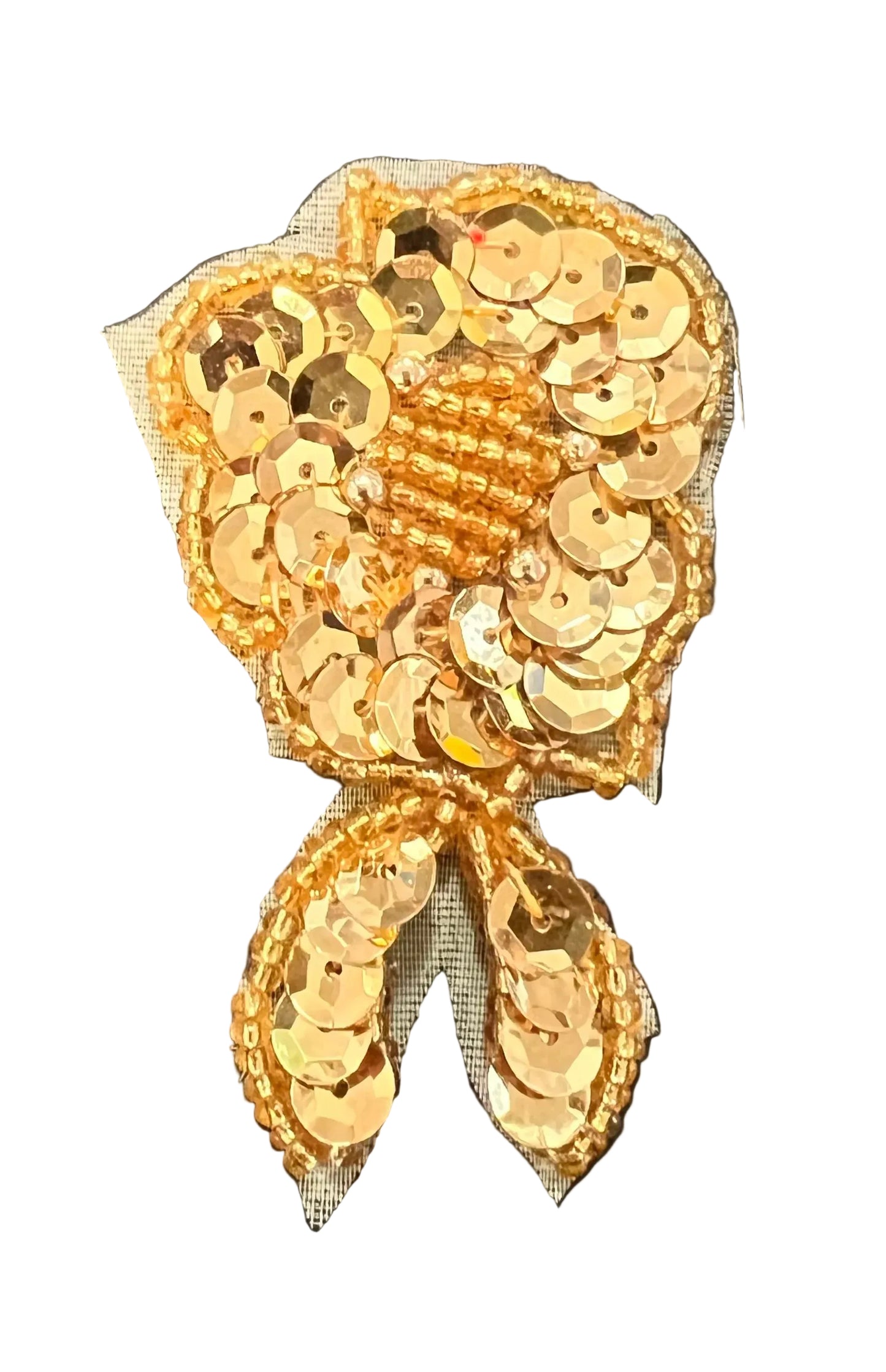 Gold sequin flower on a white background